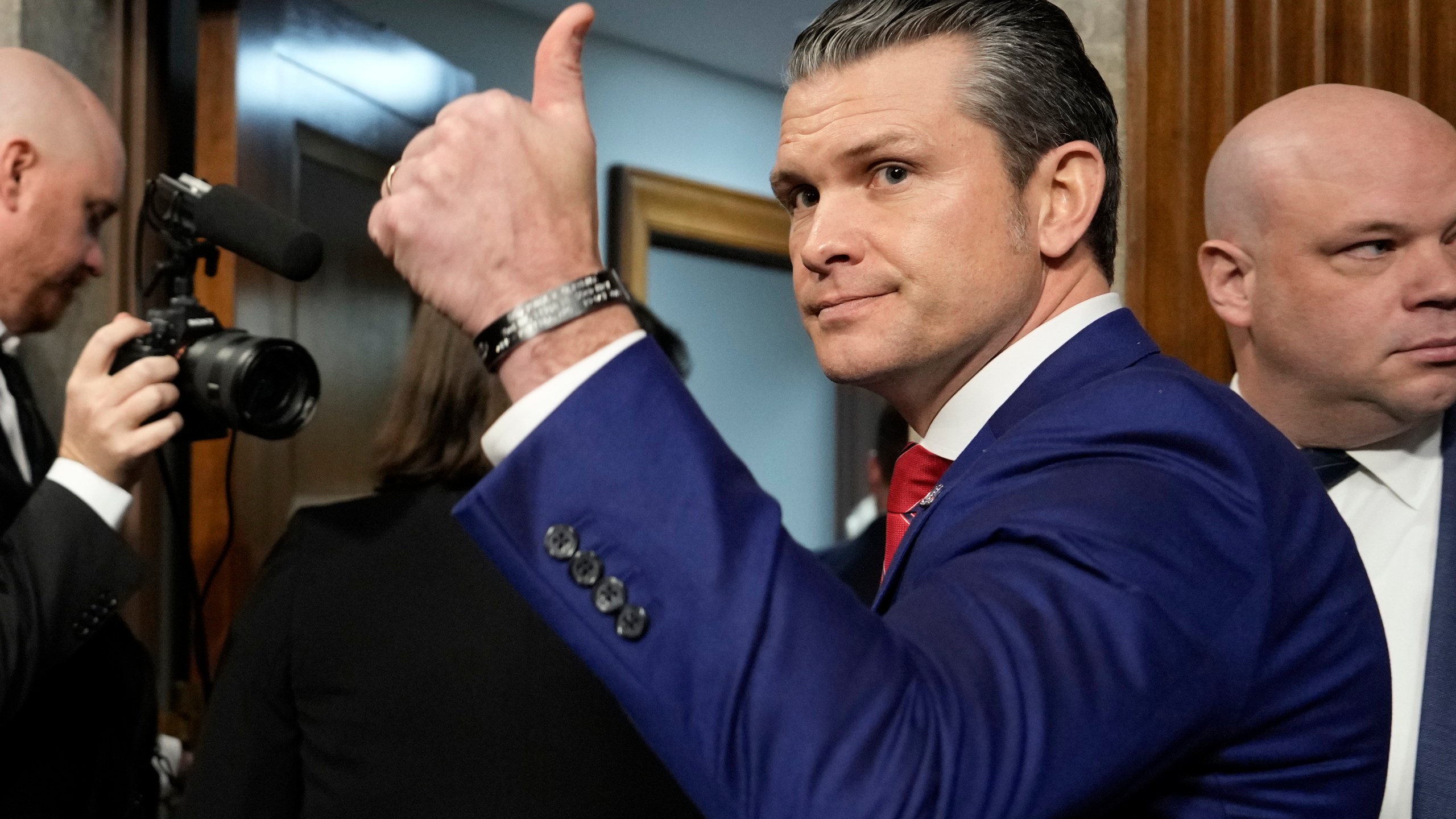 Pete Hegseth, President-elect Donald Trump's choice to be Defense secretary, gives a thumbs-up at the completion of his confirmation hearing before the Senate Armed Services Committee, at the Capitol in Washington, Tuesday, Jan. 14, 2025. (AP Photo/Ben Curtis)