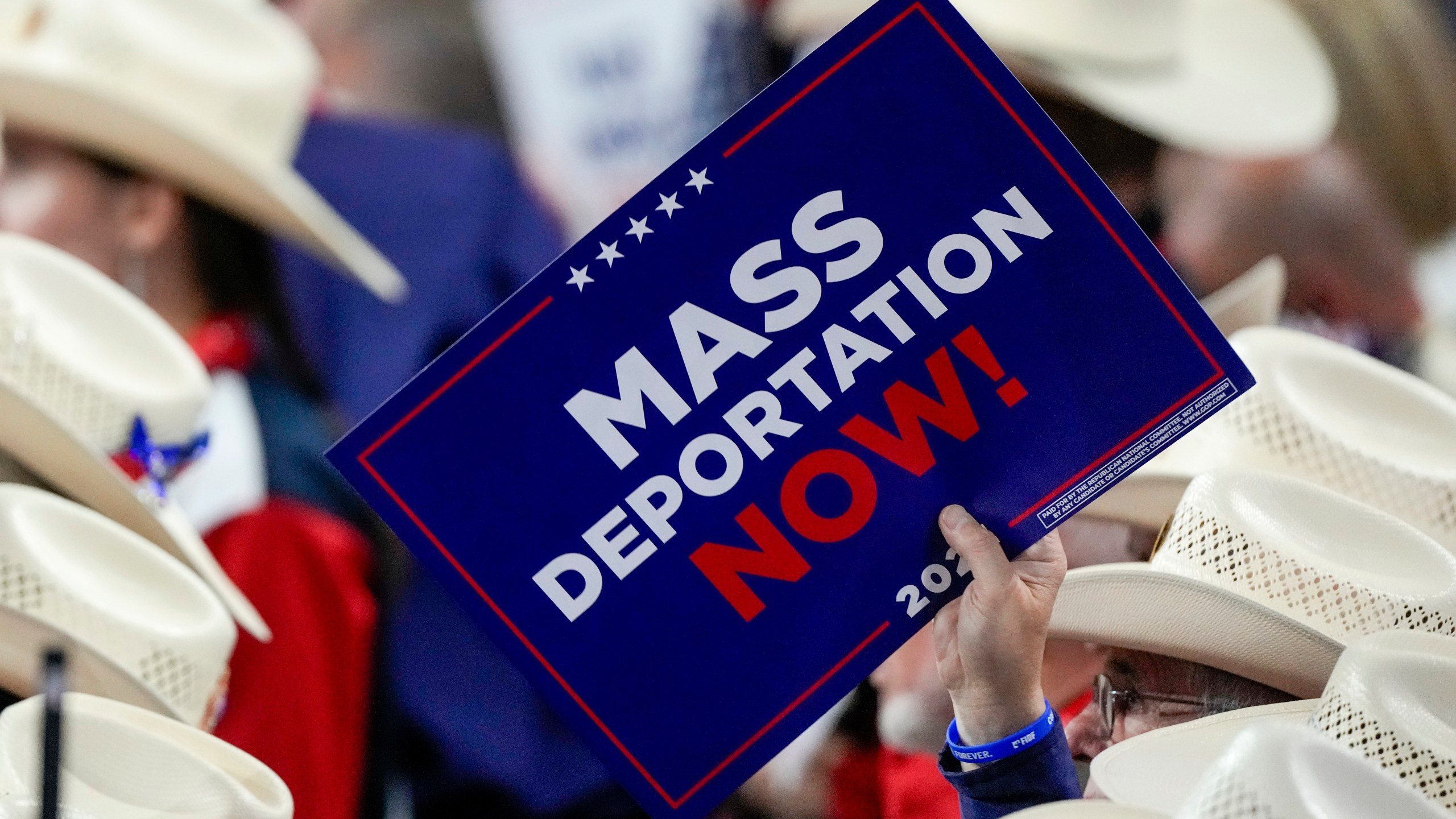 FILE - A member of the Texas delegation holds a sign during the Republican National Convention, July 17, 2024, in Milwaukee. (AP Photo/Matt Rourke, File)
