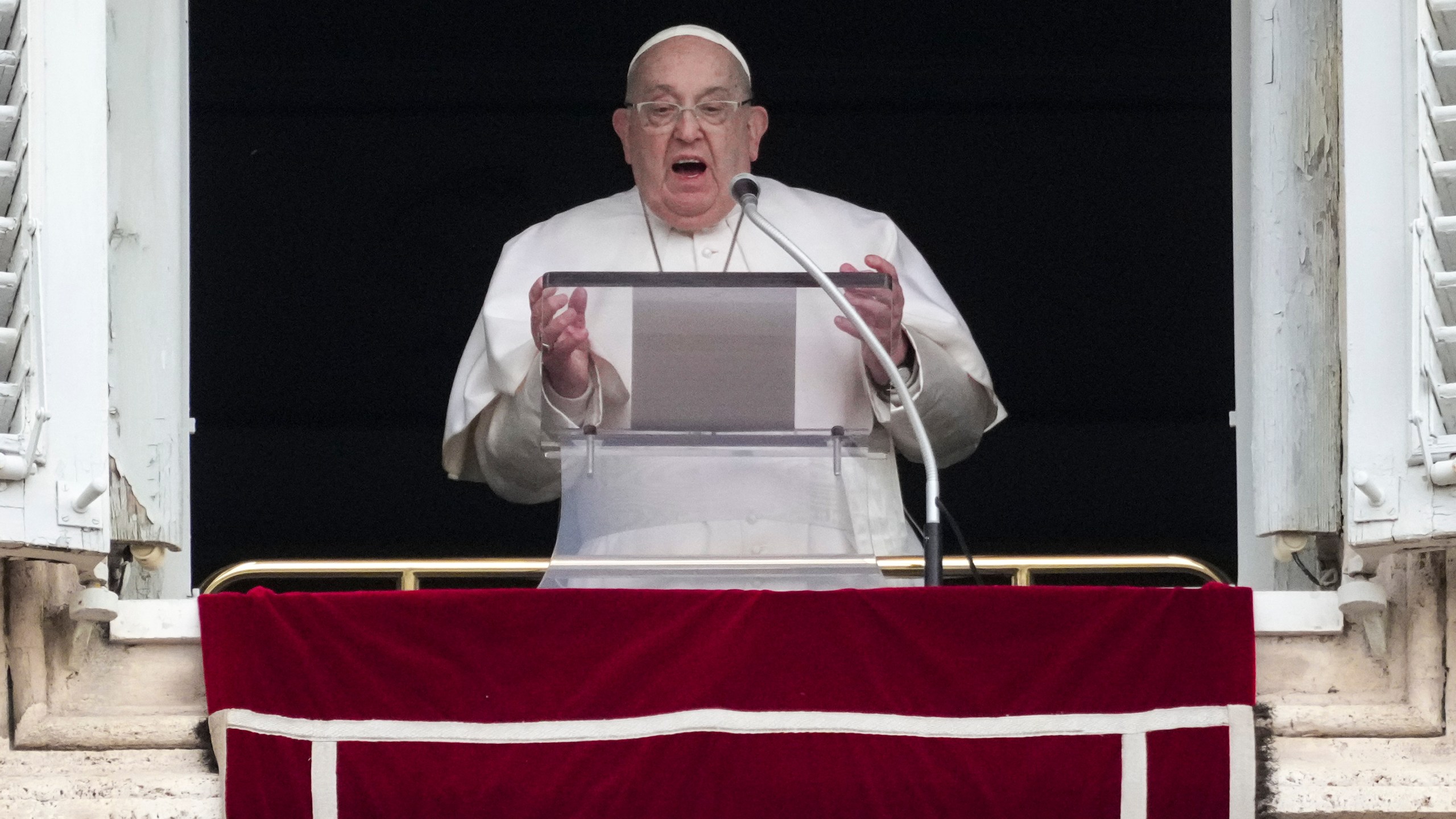 Pope Francis delivers his blessing as he recites the Angelus noon prayer from the window of his studio overlooking St.Peter's Square, at the Vatican, Sunday, Jan. 19, 2025. (AP Photo/Andrew Medichini)