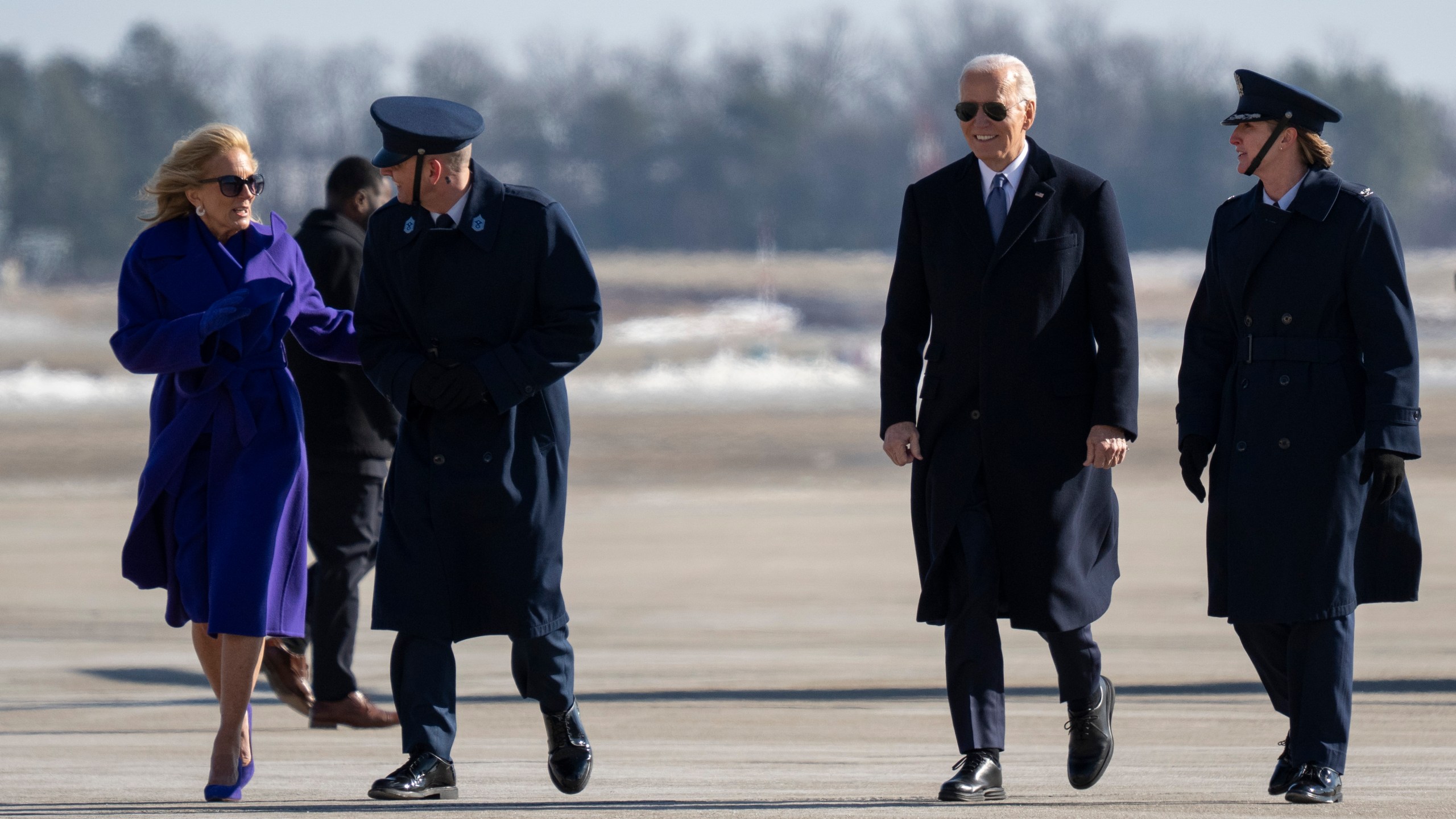 Jill Biden, Command Chief Master Sgt. Noah Bliss, 89th Airlift Wing, Former President Joe Biden and Col. Angela Ochoa, Commander, 89th Airlift Wing, left, walk at Joint Base Andrews, Md., Monday, Jan. 20, 2025. (AP Photo/Jess Rapfogel)