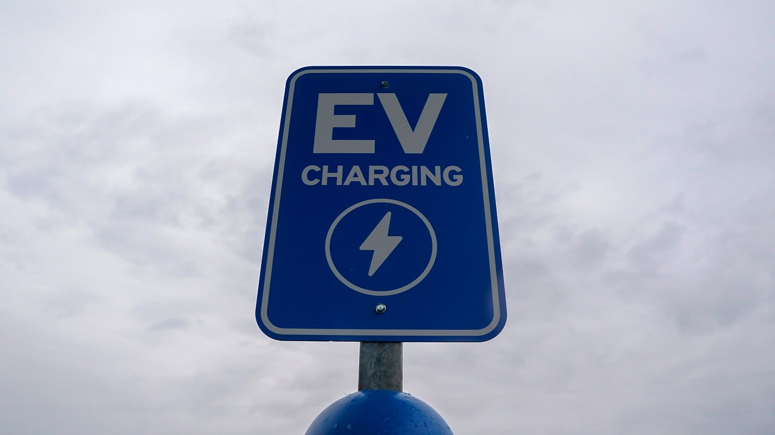 FILE - A sign is displayed at an electric vehicle charging station, March 8, 2024, in London, Ohio. (AP Photo/Joshua A. Bickel, File)
