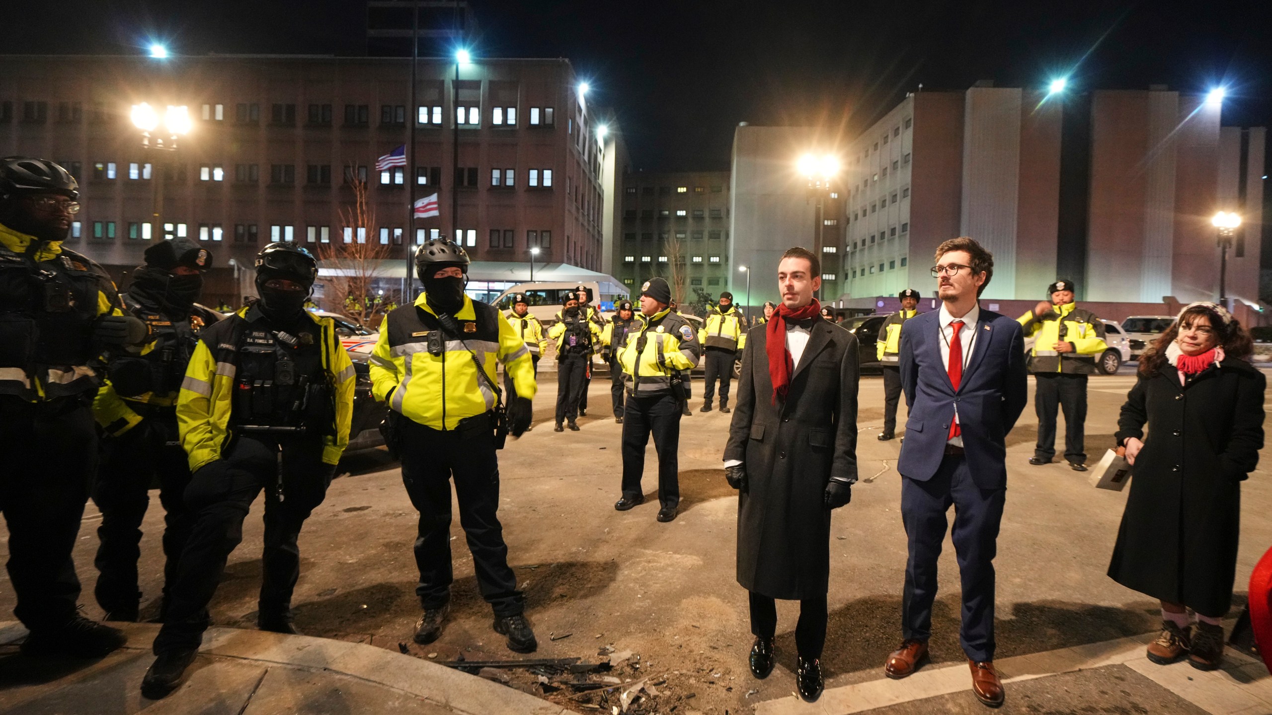 Police and media gather outside the DC Central Detention Facility, Monday, Jan. 20, 2025, in Washington. (AP Photo/Julio Cortez)