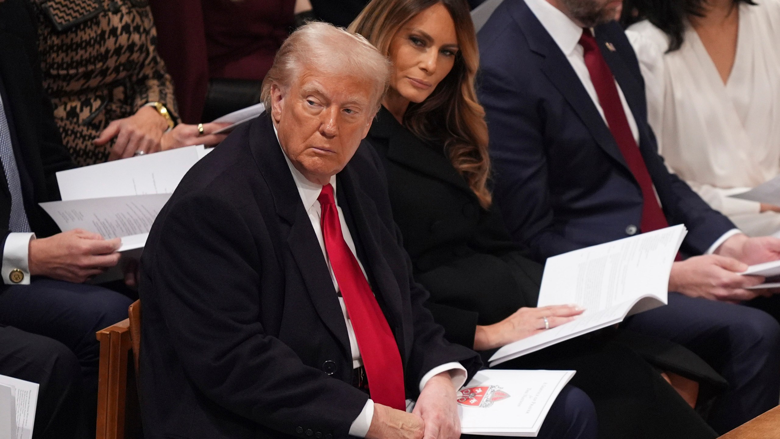 President Donald Trump, left, and first lady Melania Trump attend the national prayer service at the Washington National Cathedral, Tuesday, Jan. 21, 2025, in Washington. (AP Photo/Evan Vucci)