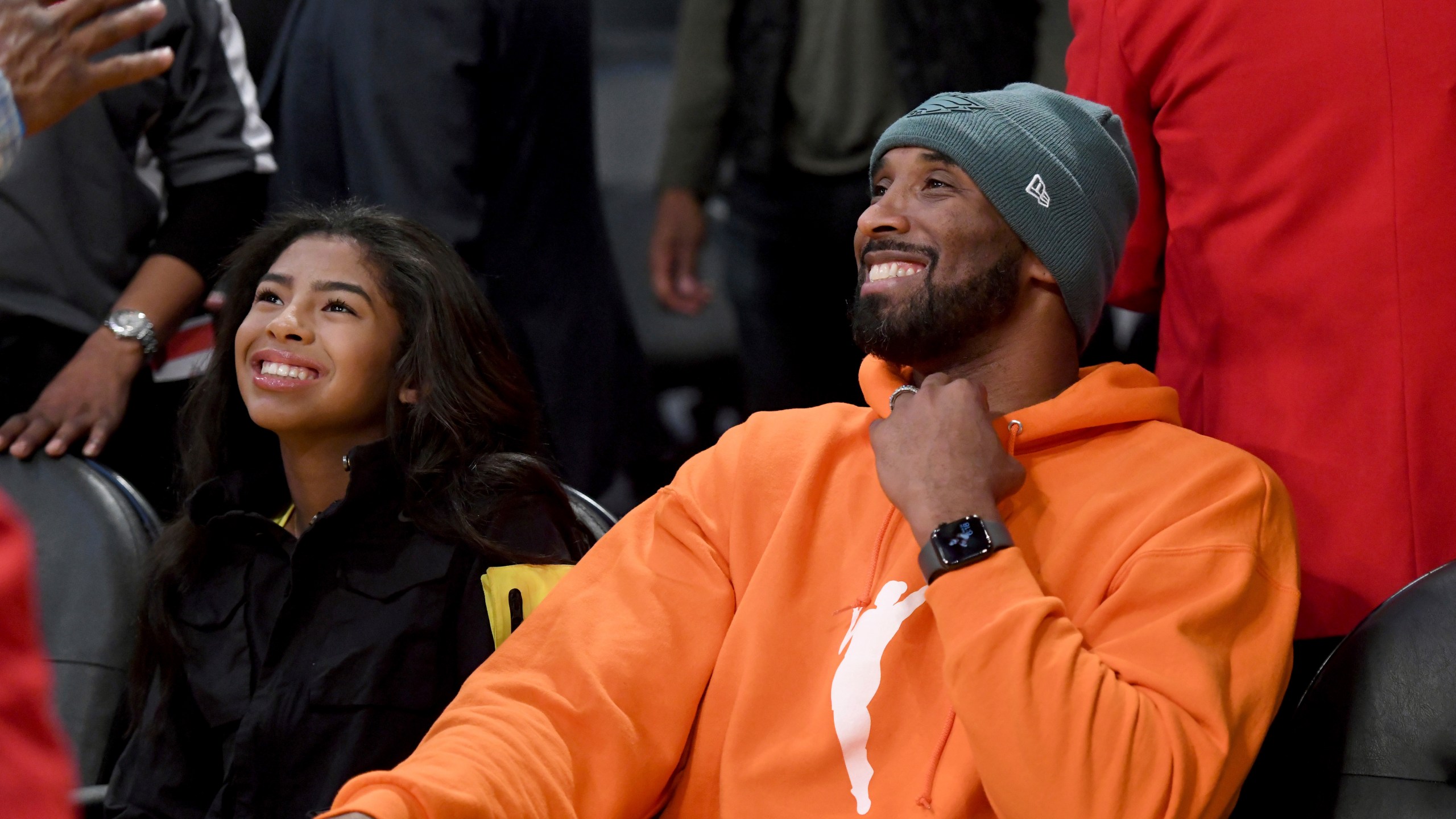 FILE - Former Los Angeles Laker Kobe Bryant and his daughter Gianna Bryant attend an NBA basketball game between the Los Angeles Lakers and Dallas Mavericks Sunday, Dec. 29, 2019, in Los Angeles. (AP Photo/Michael Owen Baker, File)