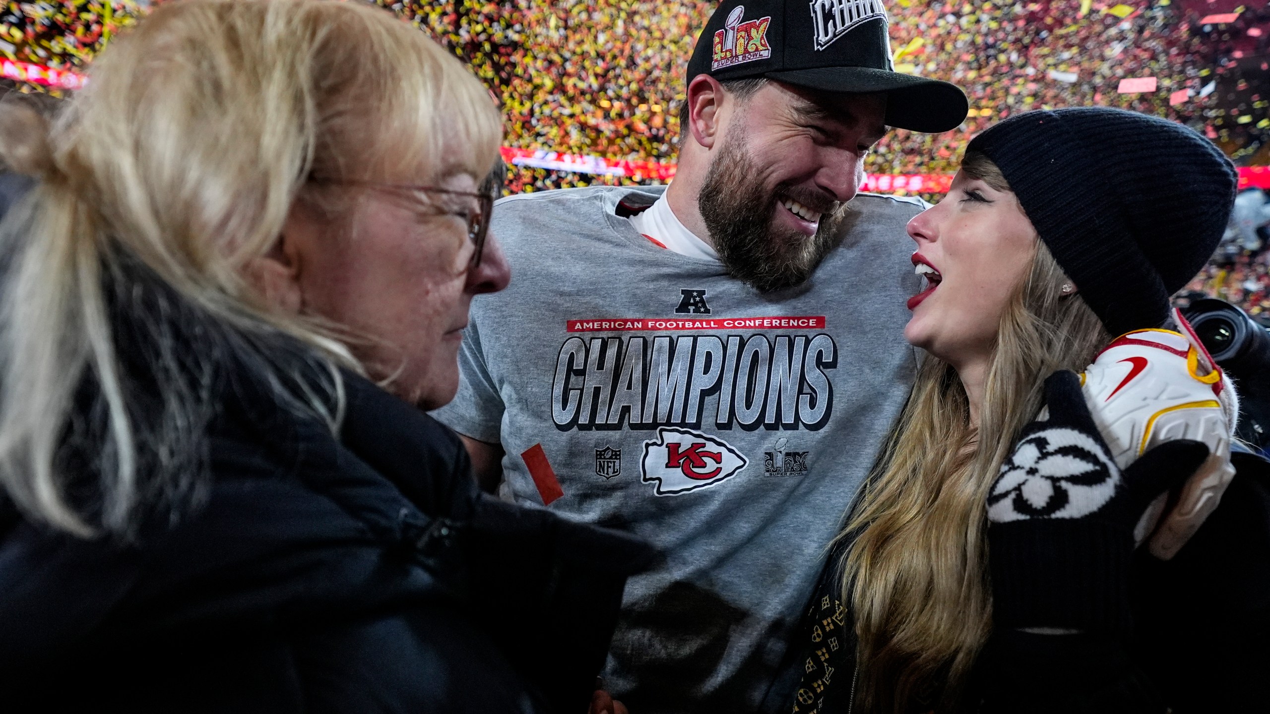 Donna Kelce stands with her son Kansas City Chiefs tight end Travis Kelce and Taylor Swift after the AFC Championship NFL football game against the Buffalo Bills, Sunday, Jan. 26, 2025, in Kansas City, Mo. (AP Photo/Ashley Landis)