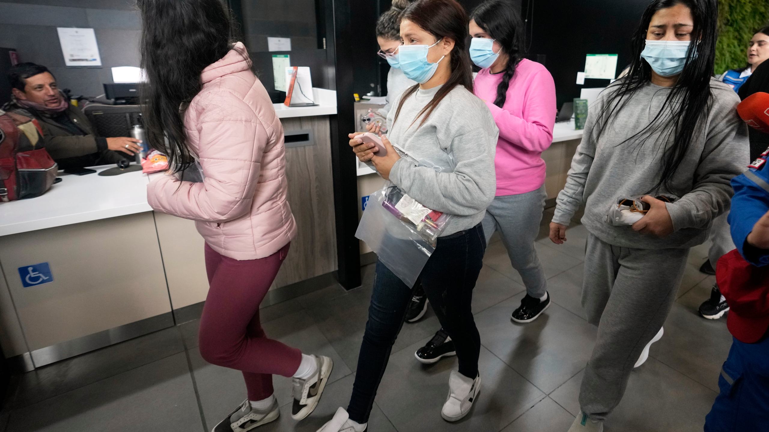 Colombian migrants deported from the United States arrive at El Dorado airport in Bogota, Colombia, Tuesday, Jan. 28, 2025. (AP Photo/Fernando Vergara)