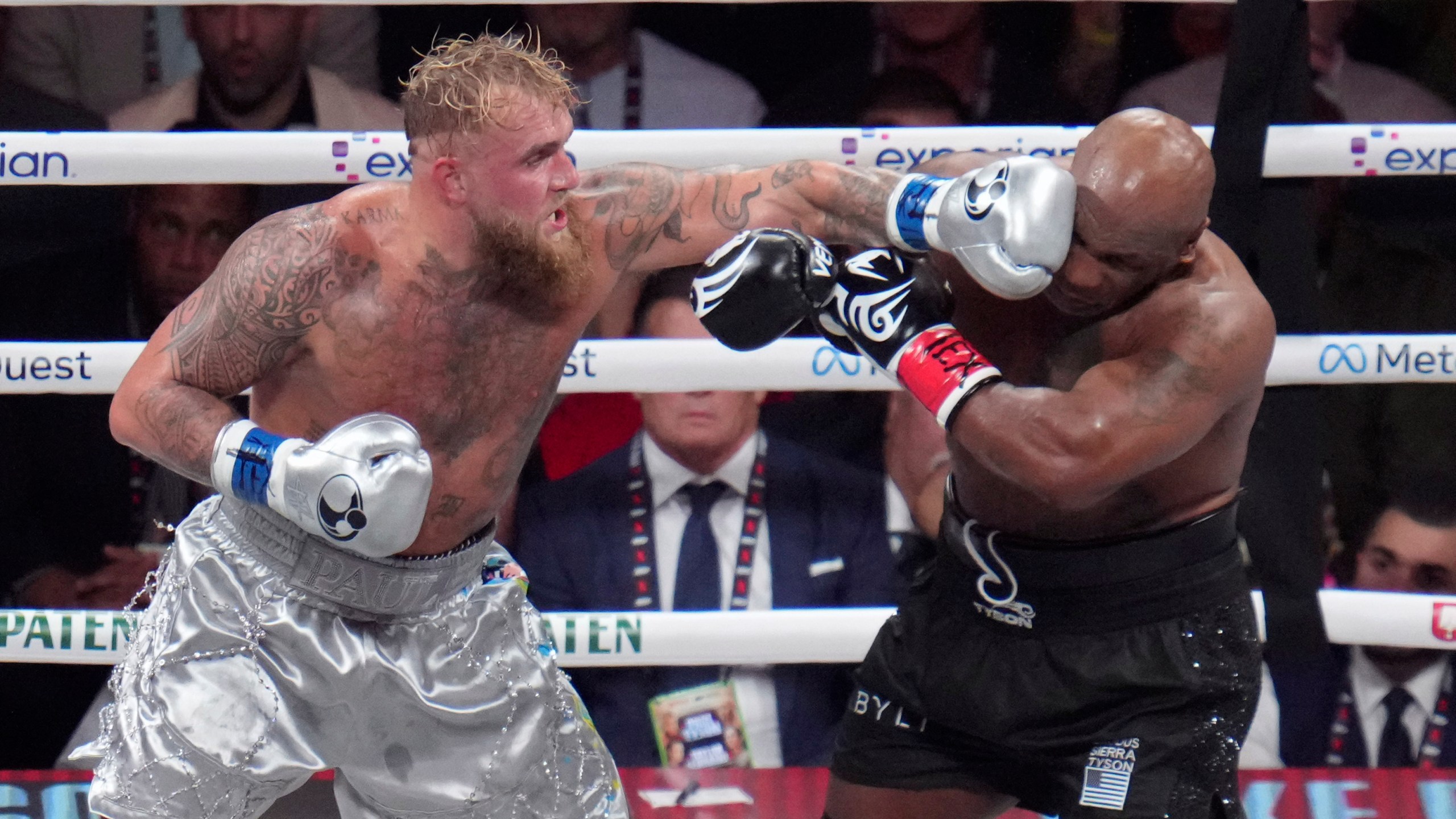 FILE - Jake Paul lands a left to Mike Tyson during their heavyweight boxing match, Nov. 15, 2024, in Arlington, Texas. (AP Photo/Julio Cortez, File)