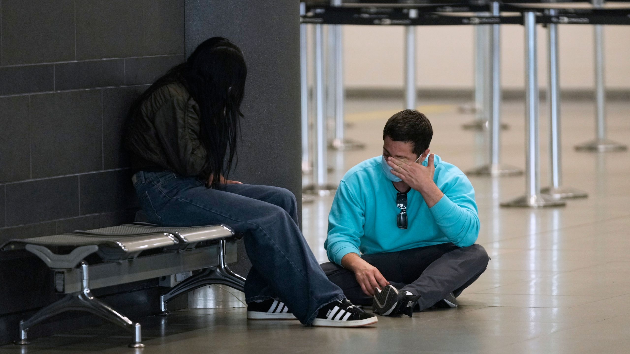 Colombian migrants deported from the United States sit inside El Dorado airport after their arrival to Bogota, Colombia, Tuesday, Jan. 28, 2025. (AP Photo/Fernando Vergara)