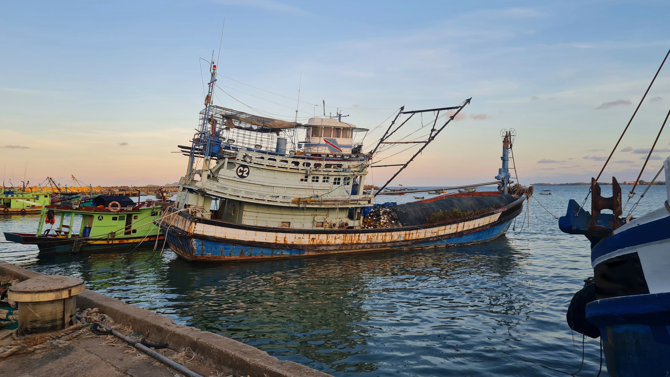 This undated photo shows Vietnamese owned fishing vessels that are registered to a Malaysian company docked at a Malaysian port. (Panthera/Sunway University via AP)