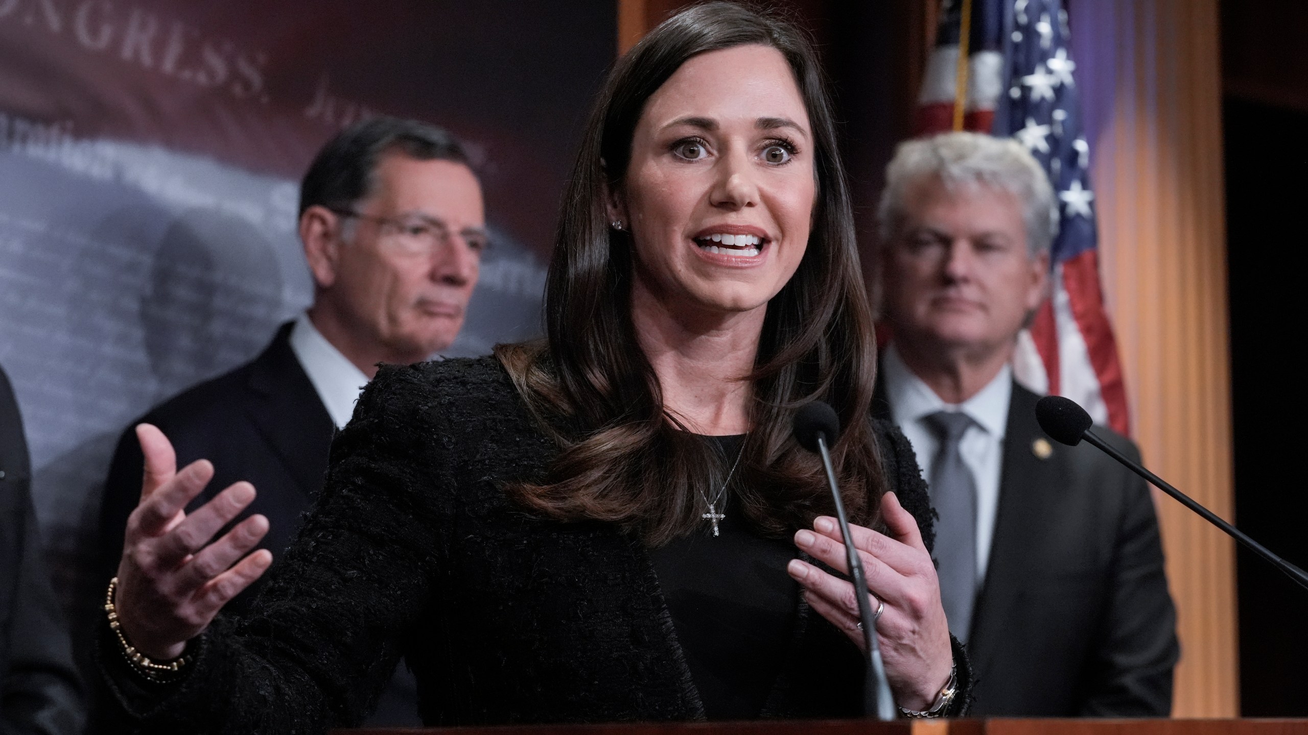 Sen. Katie Britt, R-Ala., center, is joined by Sen. John Barrasso, R-Wyo., the GOP whip, left, and Rep. Mike Collins, R-Ga., as they talk to reporters about the Laken Riley Act, a bill to detain unauthorized immigrants who have been accused of certain crimes, at the Capitol in Washington, Thursday, Jan. 9, 2025. Georgia nursing student Laken Riley was killed last year by a Venezuelan man who entered the U.S. illegally and was allowed to stay to pursue his immigration case. (AP Photo/J. Scott Applewhite)