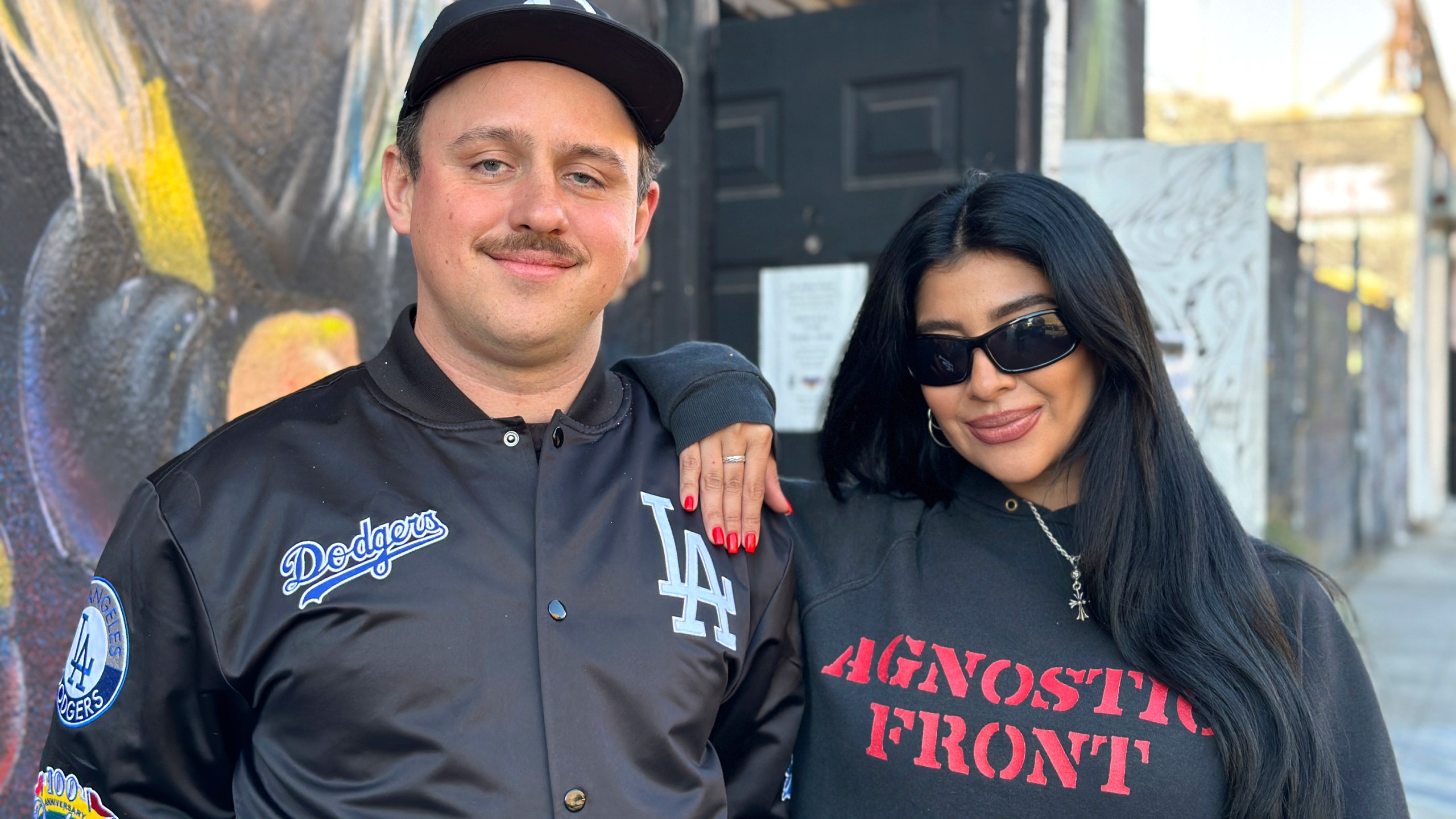 Superchief Art Gallery co-founder and director Bill Dunleavy, left, appears with creative director Celina Rodriguez on Thursday, Jan. 16, 2025, in Los Angeles. The two LA creatives partnered together to organize and transform the art gallery into a donation center for those affected by the California wildfires. (AP Photo/Leslie Ambriz)