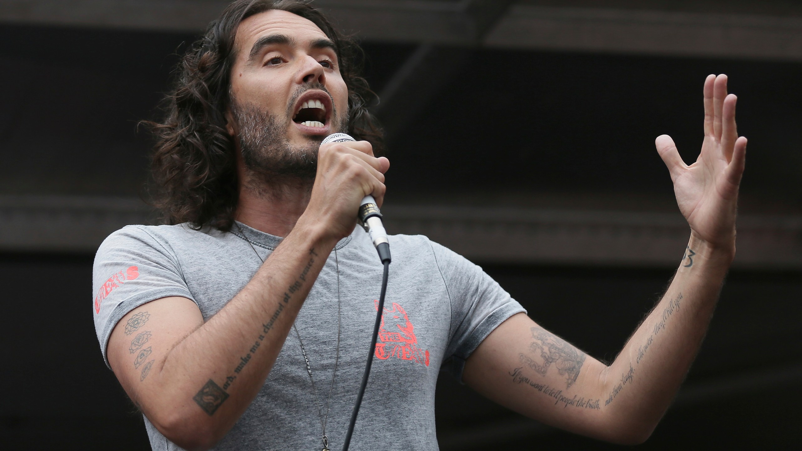 FILE - Comedian Russell Brand speaks in Parliament Square during a protest against the Conservative Government and it's austerity policies in London, Saturday, June 20, 2015. (AP Photo/Tim Ireland, File)