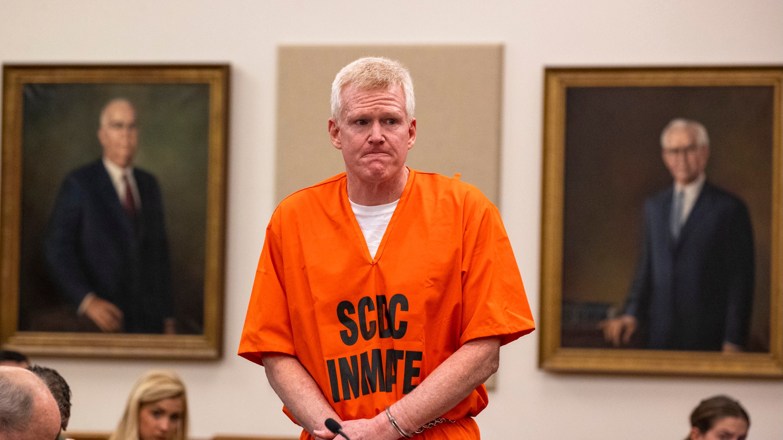Alex Murdaugh addresses court in an orange jumpsuit and handcuffs