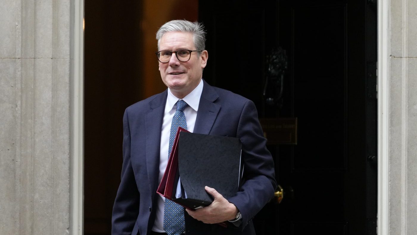 Keir Starmer exits a building
