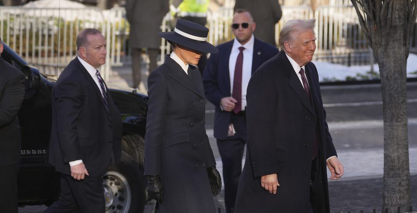 Melania Trump walks alongside her husband ahead of his inauguration