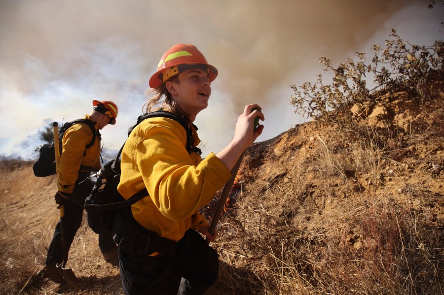Firefighters work to control the spread of the Hughes Fire in Castaic, Calif., Wednesday, Jan. 22, 2025.