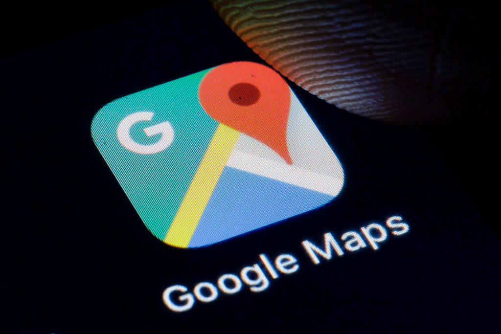 The Logo of Google Maps is displayed on a smartphone