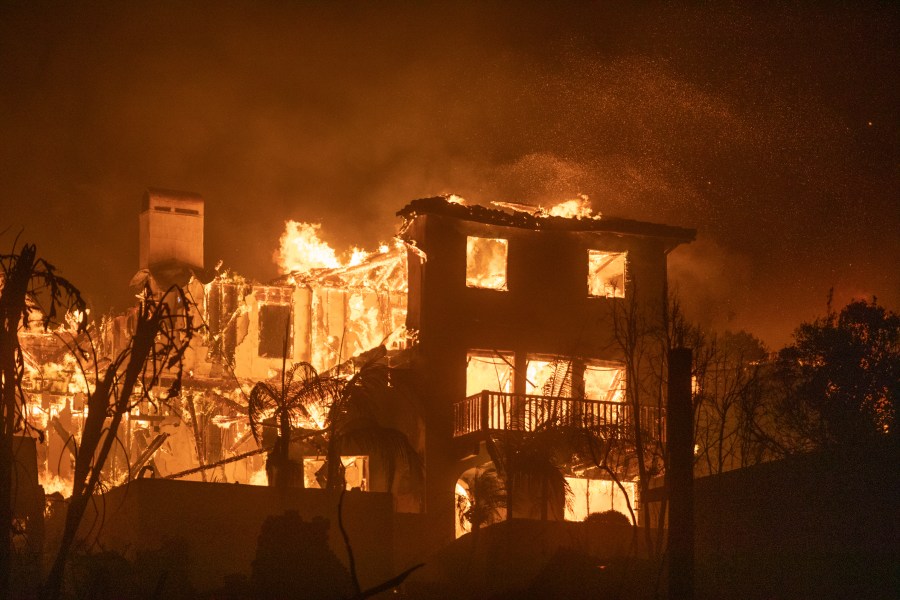 A fire burns homes on the Pacific Coast Highway.