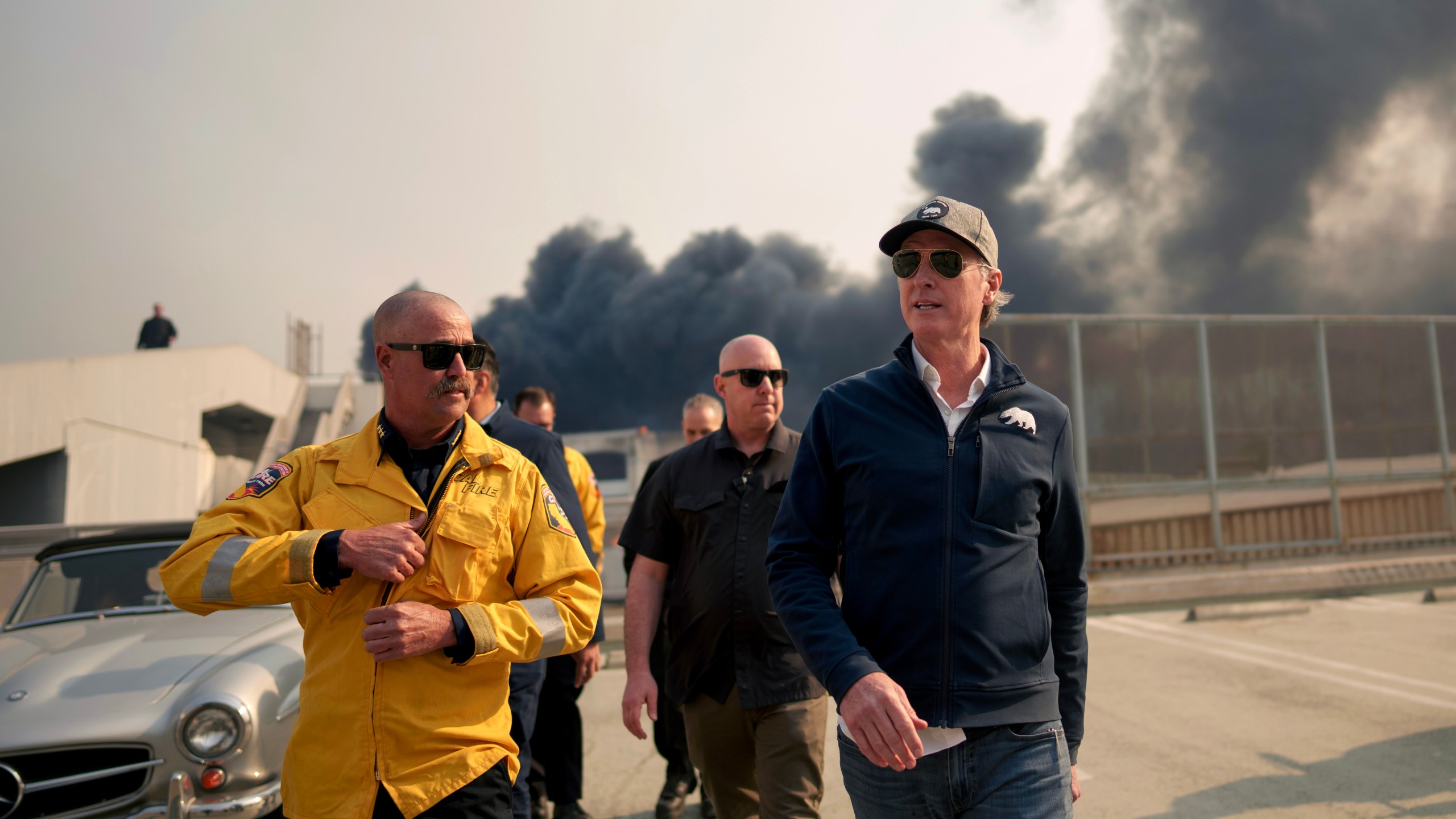 California Governor Gavin Newsom tours an area impacted by fires.