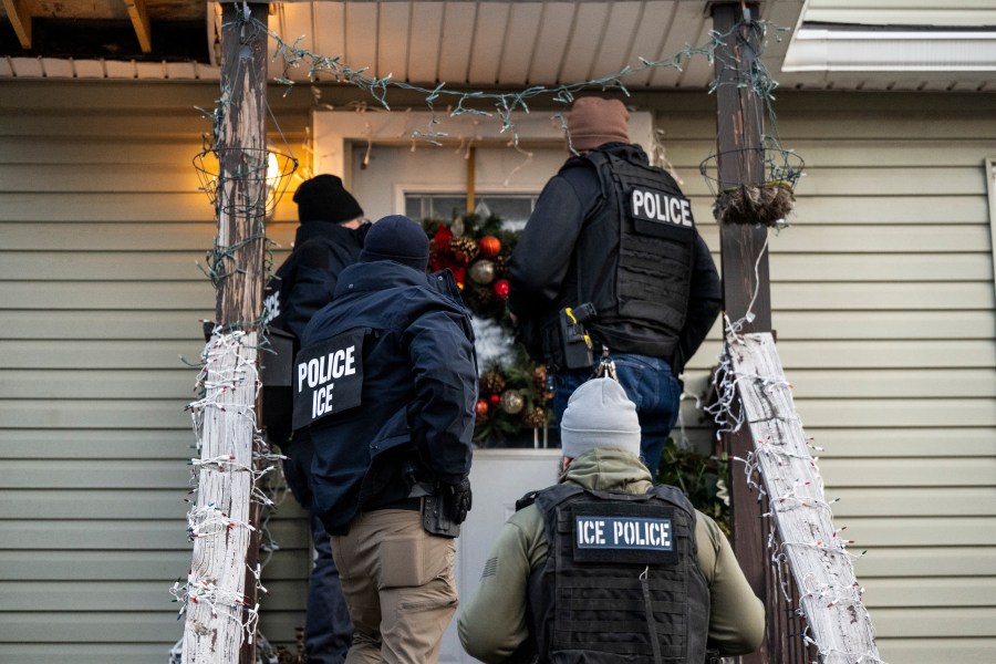 ICE agents knocking on the door of a residence