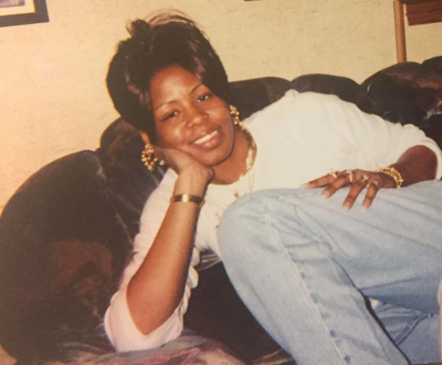 A black woman on a couch