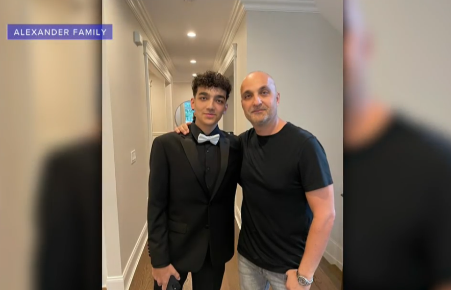 Edan Alexander poses for a picture with his father, Adi.