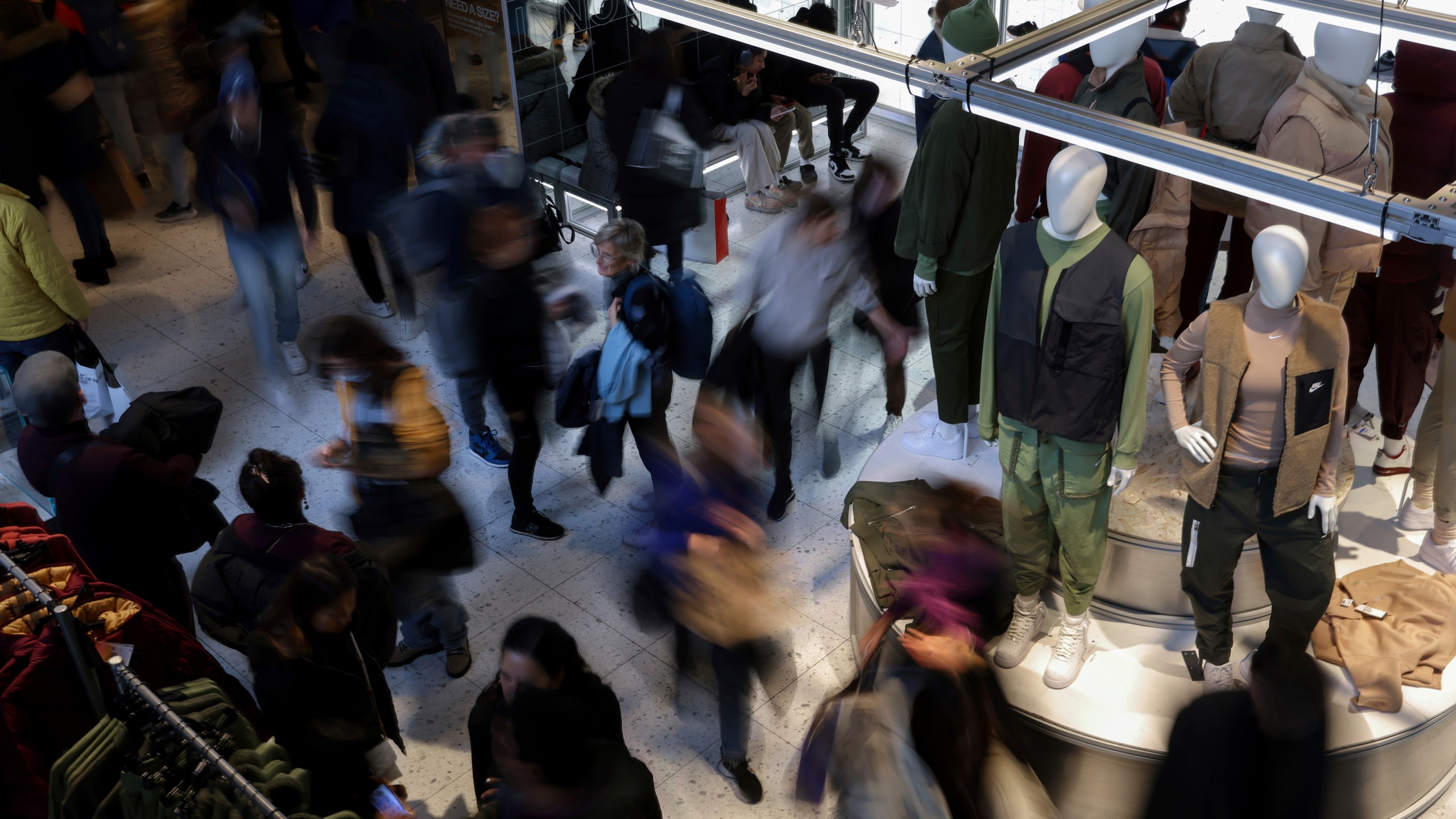 FILE - People shop at a retail store on Black Friday, Nov. 25, 2022, in New York. (AP Photo/Julia Nikhinson, File)