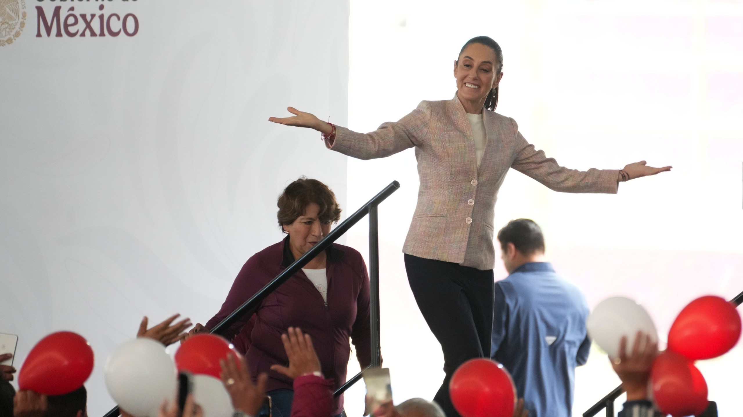 President Claudia Sheinbaum waves as she arrives for a Housing for Wellbeing event, a government-funded home improvement program, in Mexico City, Saturday, Feb. 1, 2025. (AP Photo/Marco Ugarte)
