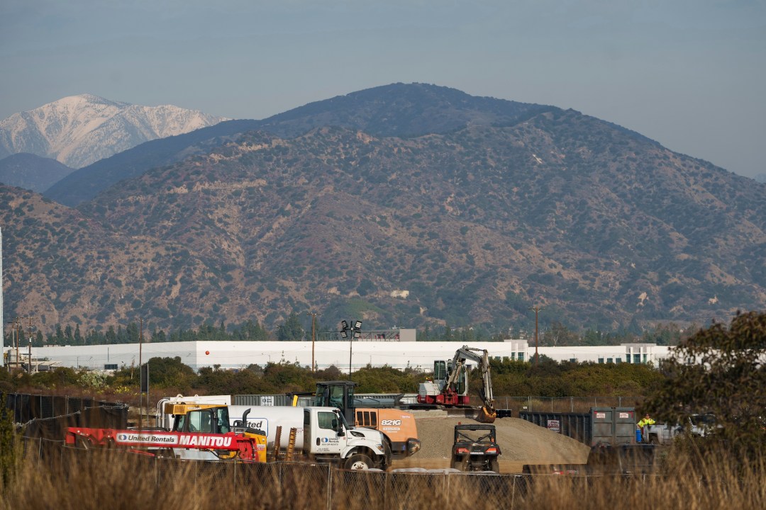 Construction workers set up gravel in California.