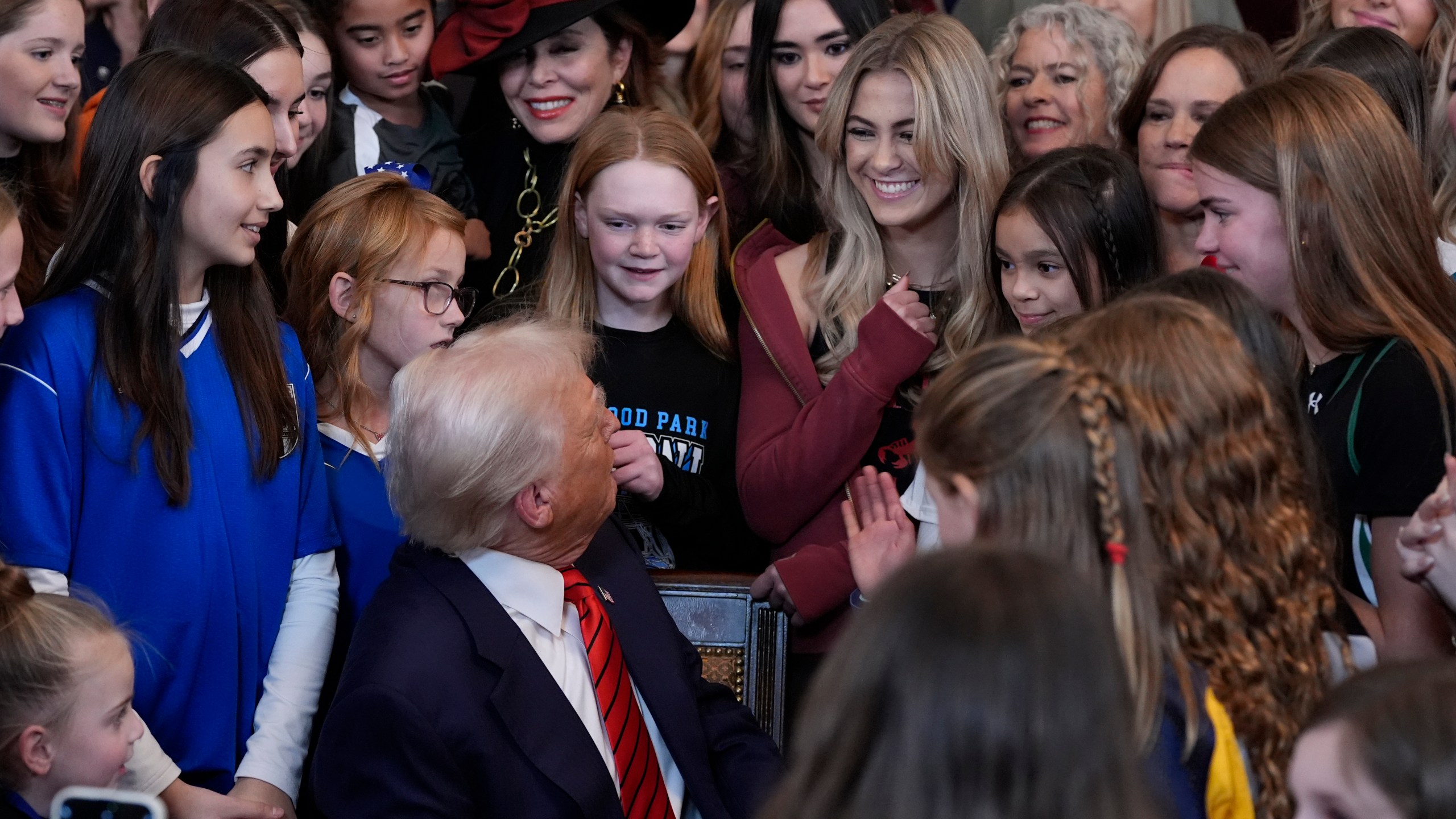 President Donald Trump looks back after he signs an executive order barring transgender female athletes from competing in women's or girls' sporting events, in the East Room of the White House, Wednesday, Feb. 5, 2025, in Washington. (AP Photo/Alex Brandon)