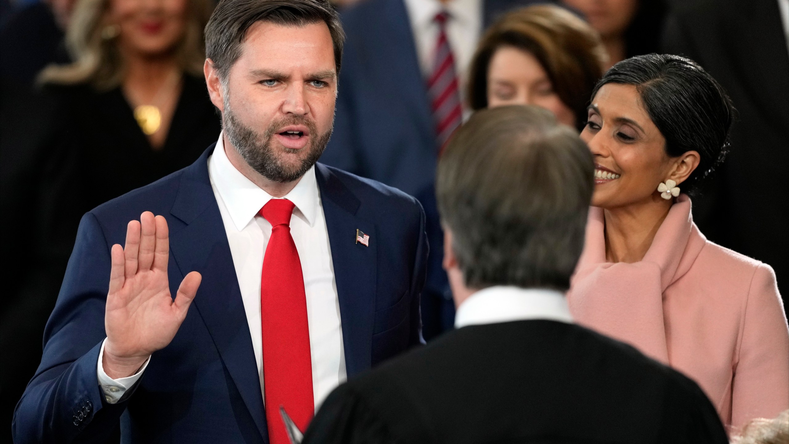 JD Vance is sworn in as vice president by Supreme Court Justice Brett Kavanaugh as Usha Vance holds the Bible during the 60th Presidential Inauguration in the Rotunda of the U.S. Capitol in Washington, Monday, Jan. 20, 2025. (AP Photo/Julia Demaree Nikhinson, Pool)