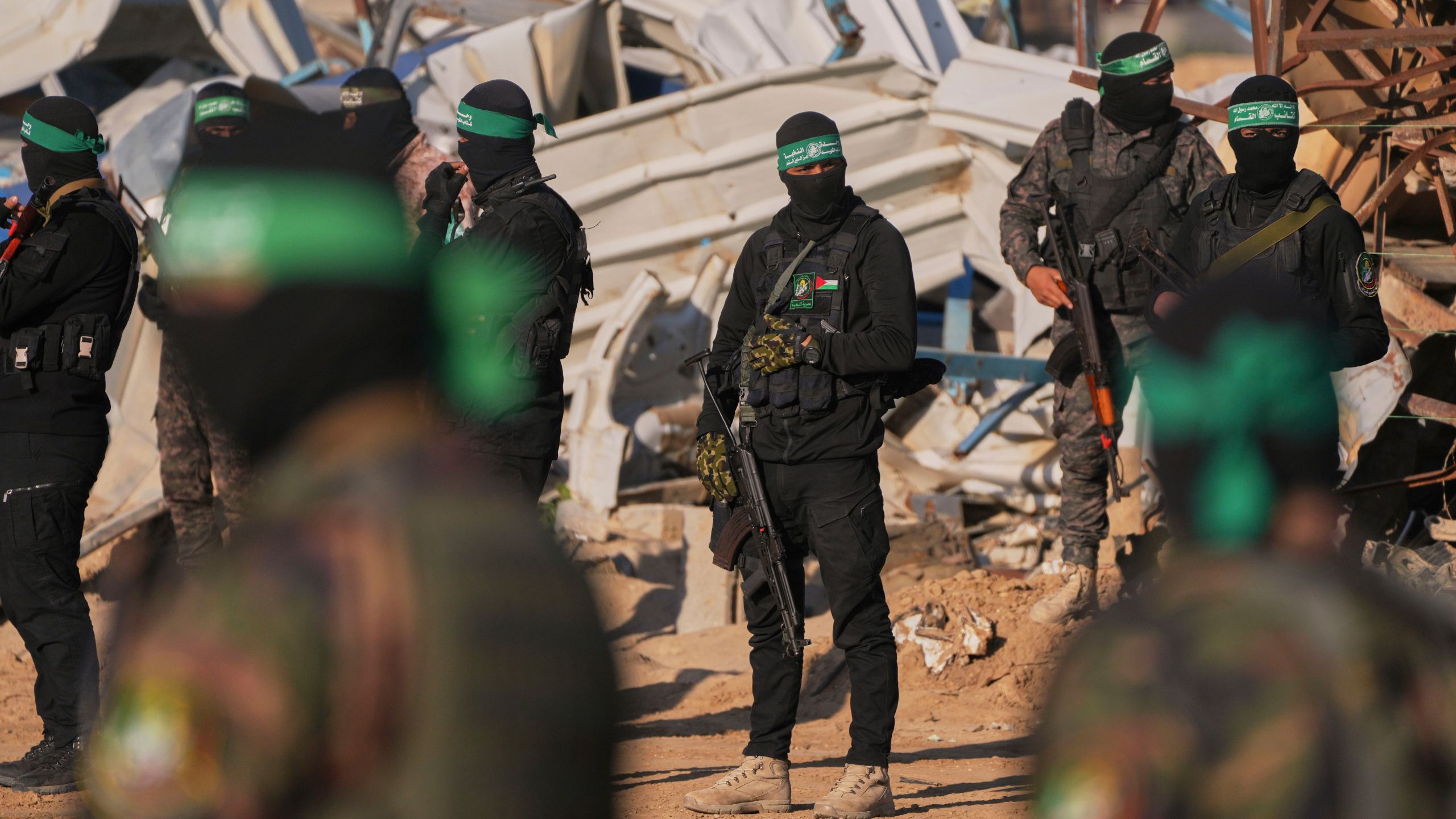 FILE - Hamas fighters take up positions ahead of a hostage release in Khan Younis, southern Gaza Strip, Saturday, Feb. 1, 2025. Photo/Abdel Kareem, File)