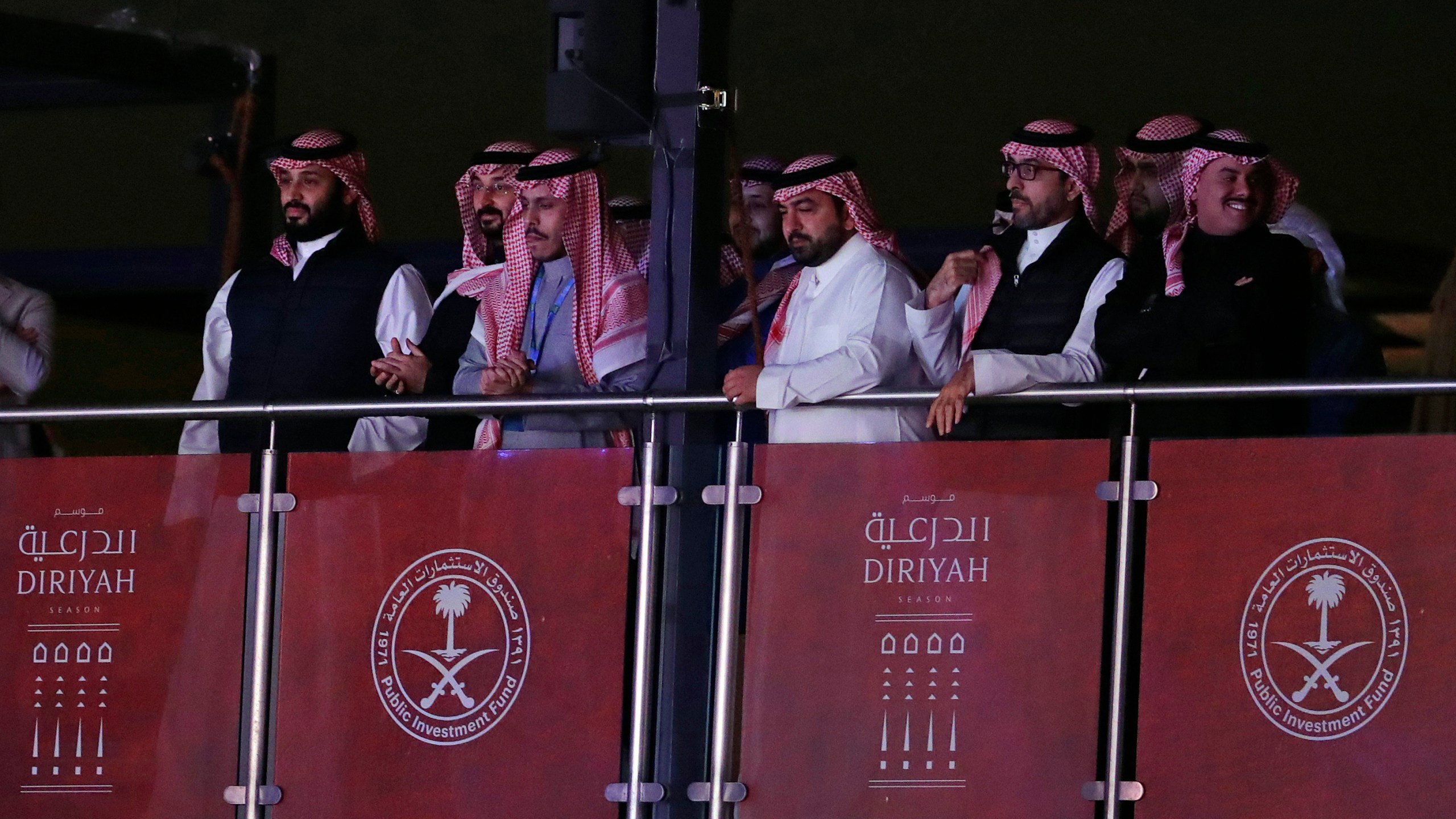 FILE - Saudi Crown Prince Mohammed bin Salman, left, watches as defending champion Andy Ruiz Jr. fights Britain's Anthony Joshua in a World Heavyweight Championship boxing contest at the Diriyah Arena, Riyadh, Saudi Arabia on Dec. 8, 2019. (AP Photo/Hassan Ammar, File)