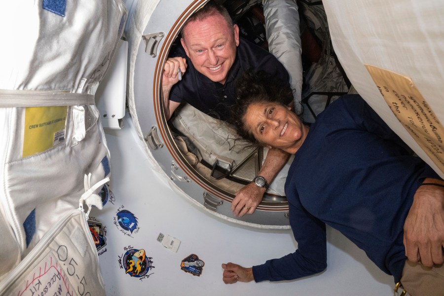 Butch Wilmore and Suni Williams pose for a portrait in space