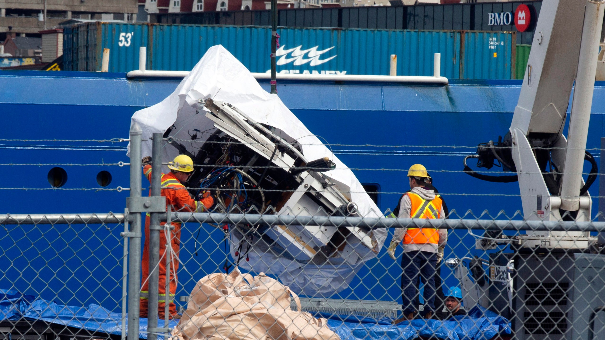 FILE - Debris from the Titan submersible, recovered from the ocean floor near the wreck of the Titanic, is unloaded from the ship Horizon Arctic at the Canadian Coast Guard pier in St. John's, Newfoundland, Wednesday, June 28, 2023. (Paul Daly/The Canadian Press via AP, File)