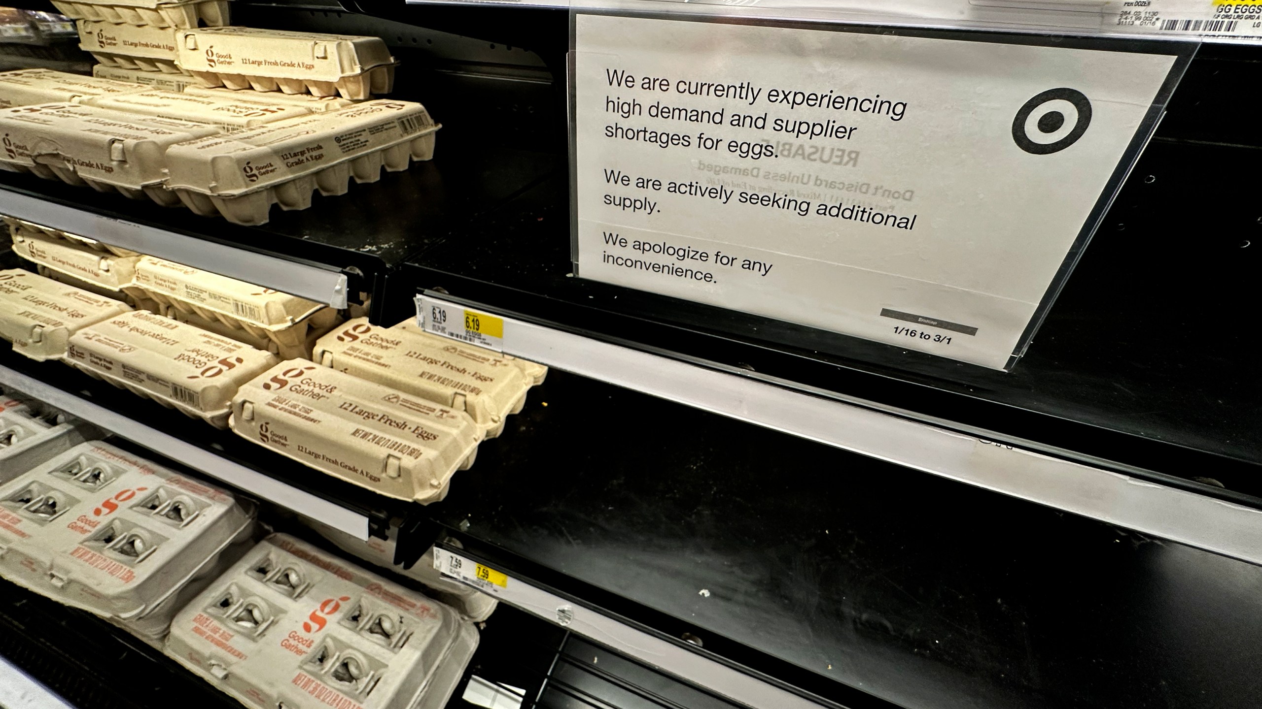 A sign is mounted on a shelve of eggs at a grocery store in Chicago, Saturday, Feb. 8, 2025. (AP Photo/Nam Y. Huh)