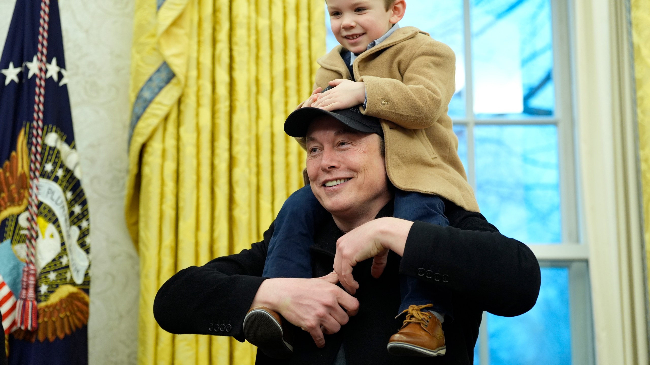 Elon Musk, joined by his son X Æ A-Xii, speaks in the Oval Office at the White House, Tuesday, Feb. 11, 2025, in Washington, during an event with President Donald Trump. (Photo/Alex Brandon)
