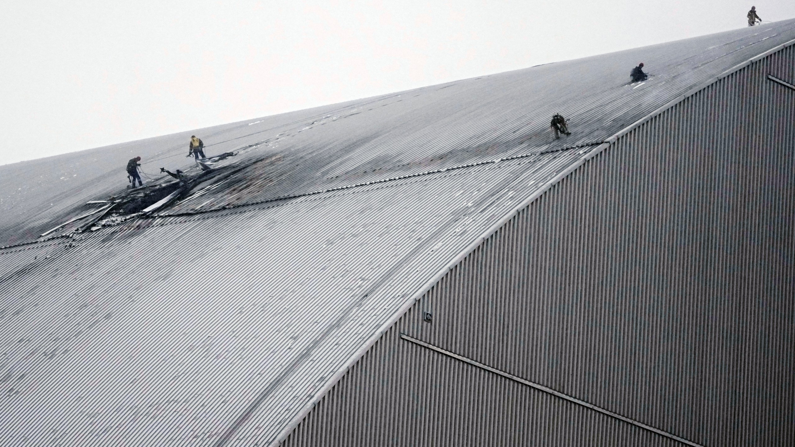A view of the containment vessel that protects the remains of reactor number four at the former Chernobyl nuclear power plant and built to contain radiation, after a drone attack in Chernobyl, Ukraine, Friday, Feb. 14, 2025. (AP Photo/Efrem Lukatsky)
