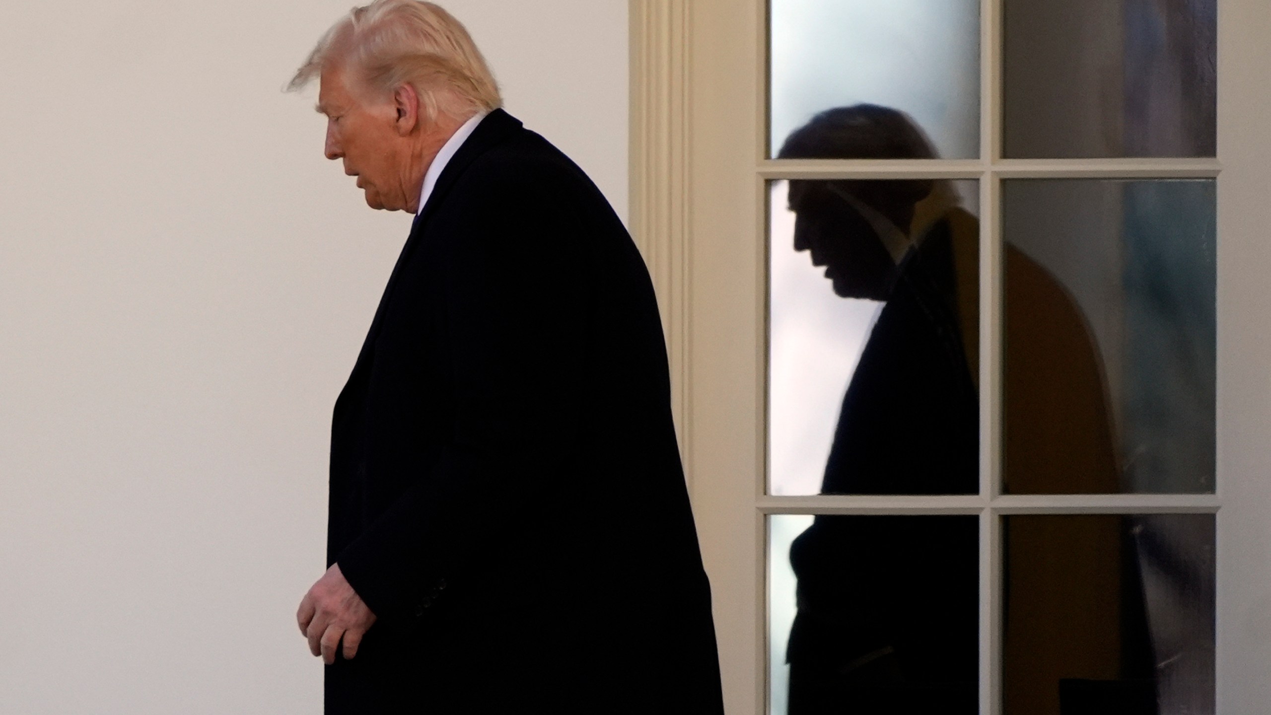 President Donald Trump walks from the Oval Office to departing on Marine One from the South Lawn of the White House, Friday, Feb. 14, 2025, in Washington. (AP Photo/Alex Brandon)