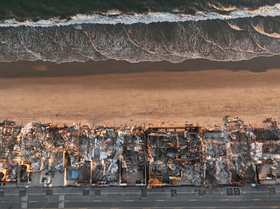 An aerial view devastation caused by the Palisades Fire