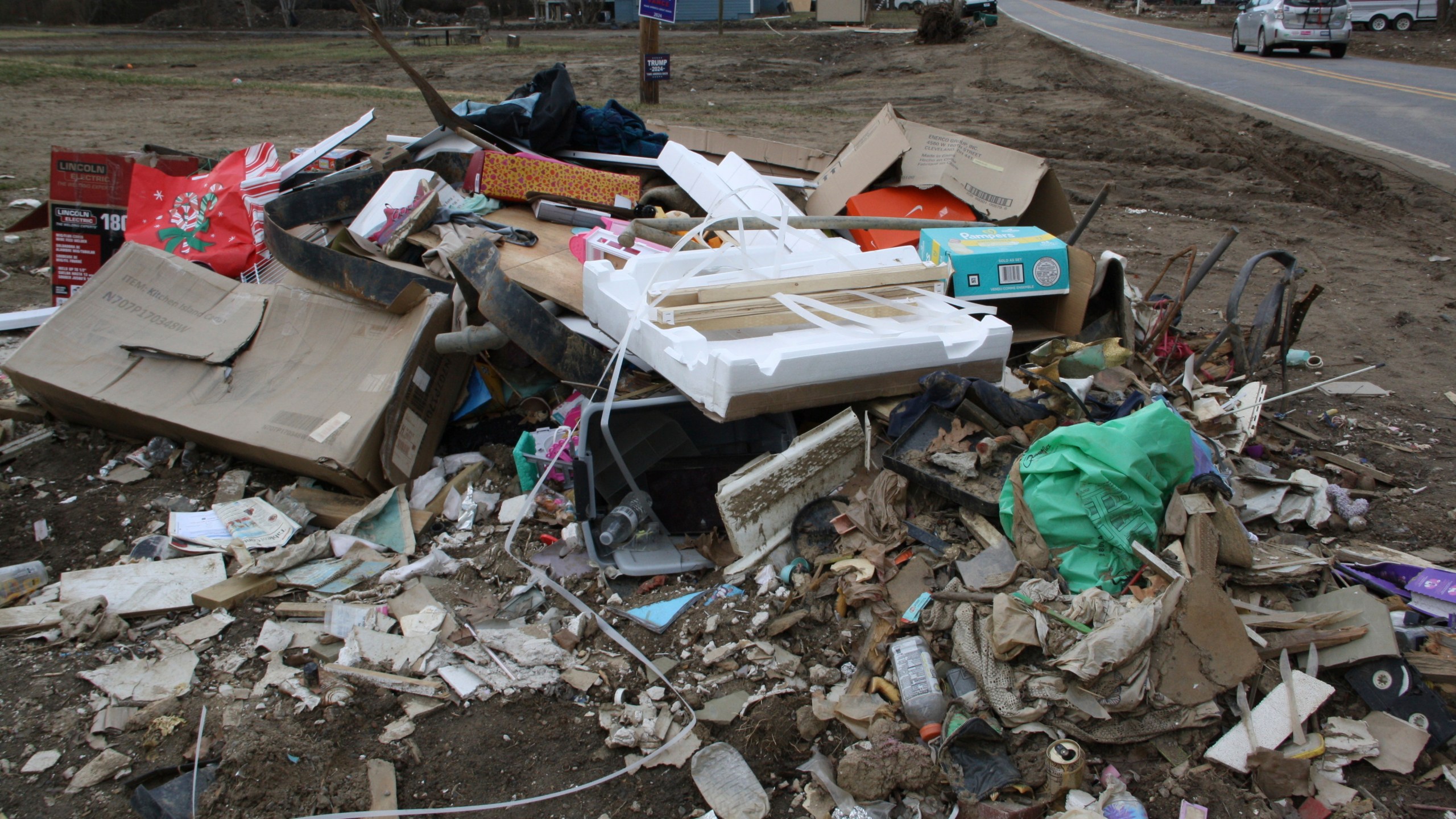 Garbage and debris sitin a heap in front of Emily Russell's home in Swannanoa, N.C., on Thursday, Feb. 6, 2025. (AP Photo/Makiya Seminera)