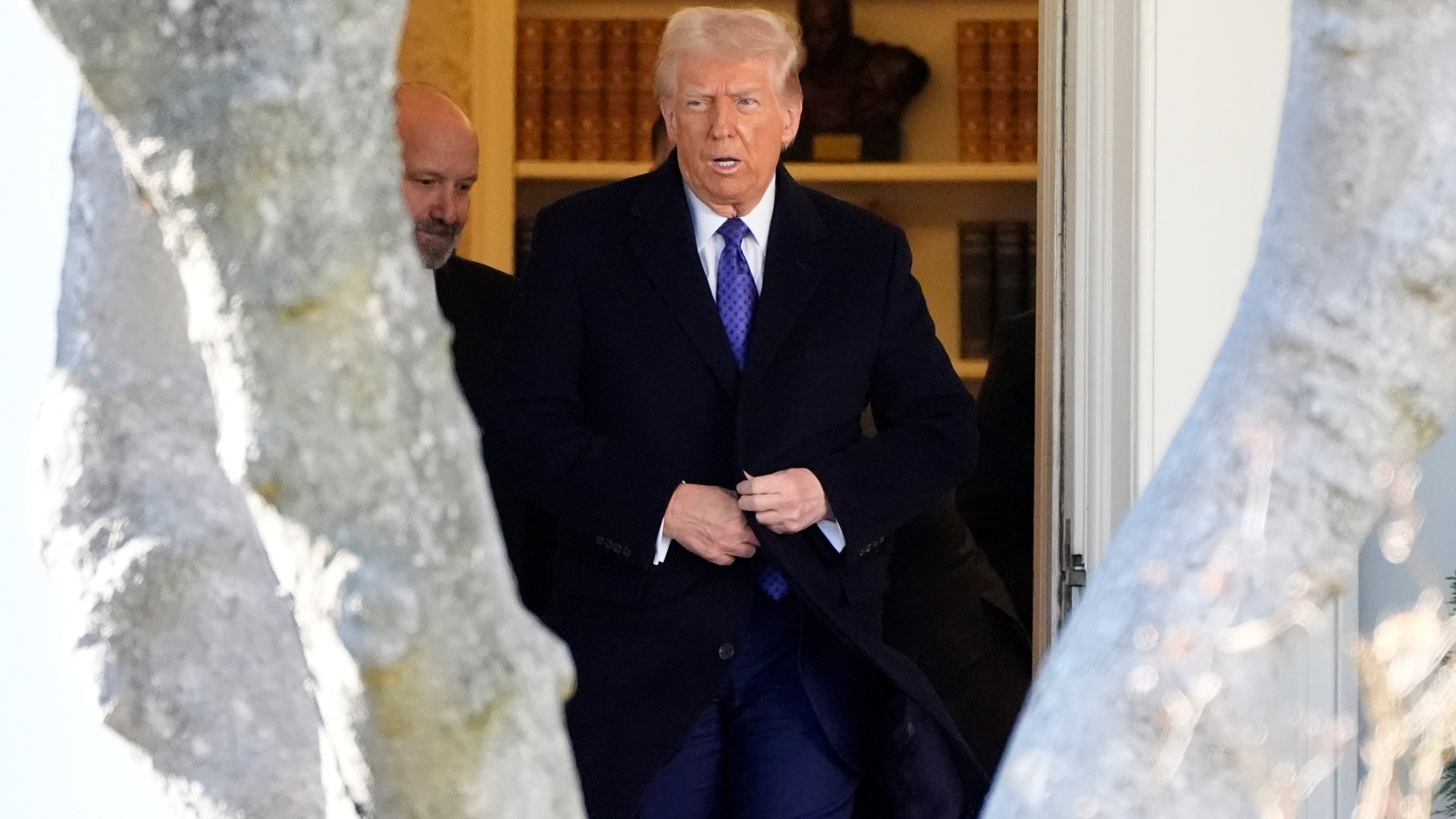 President Donald Trump walks from the Oval Office to departing on Marine One from the South Lawn of the White House, Friday, Feb. 14, 2025, in Washington. (AP Photo/Alex Brandon)