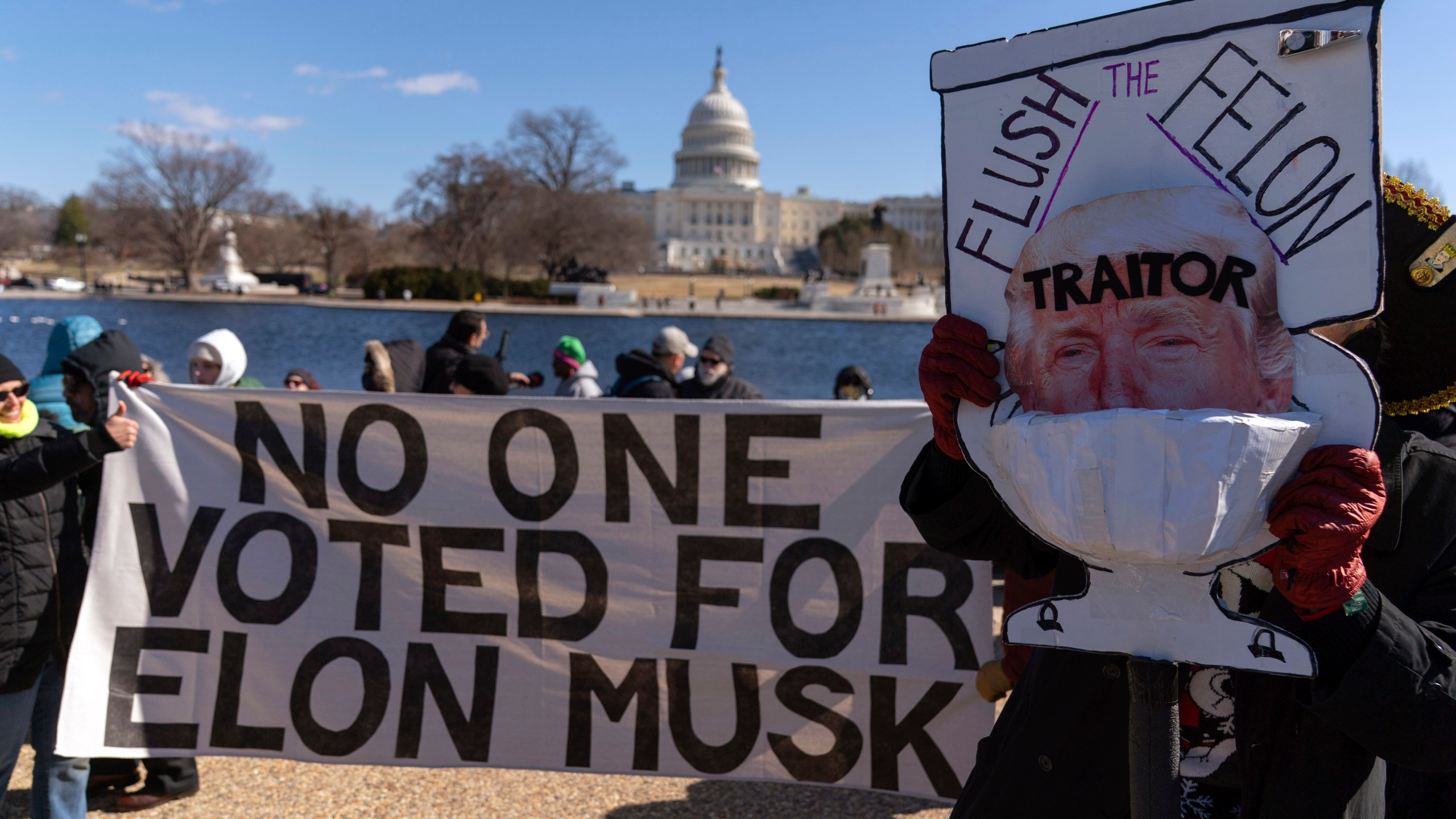 Demonstrators rally during the "No Kings Day" protest on Presidents Day in Washington, in support of federal workers and against recent actions by President Donald Trump and Elon Musk, on Capitol Hill in Washington Monday, Feb. 17, 2025. (AP Photo/Jose Luis Magana)