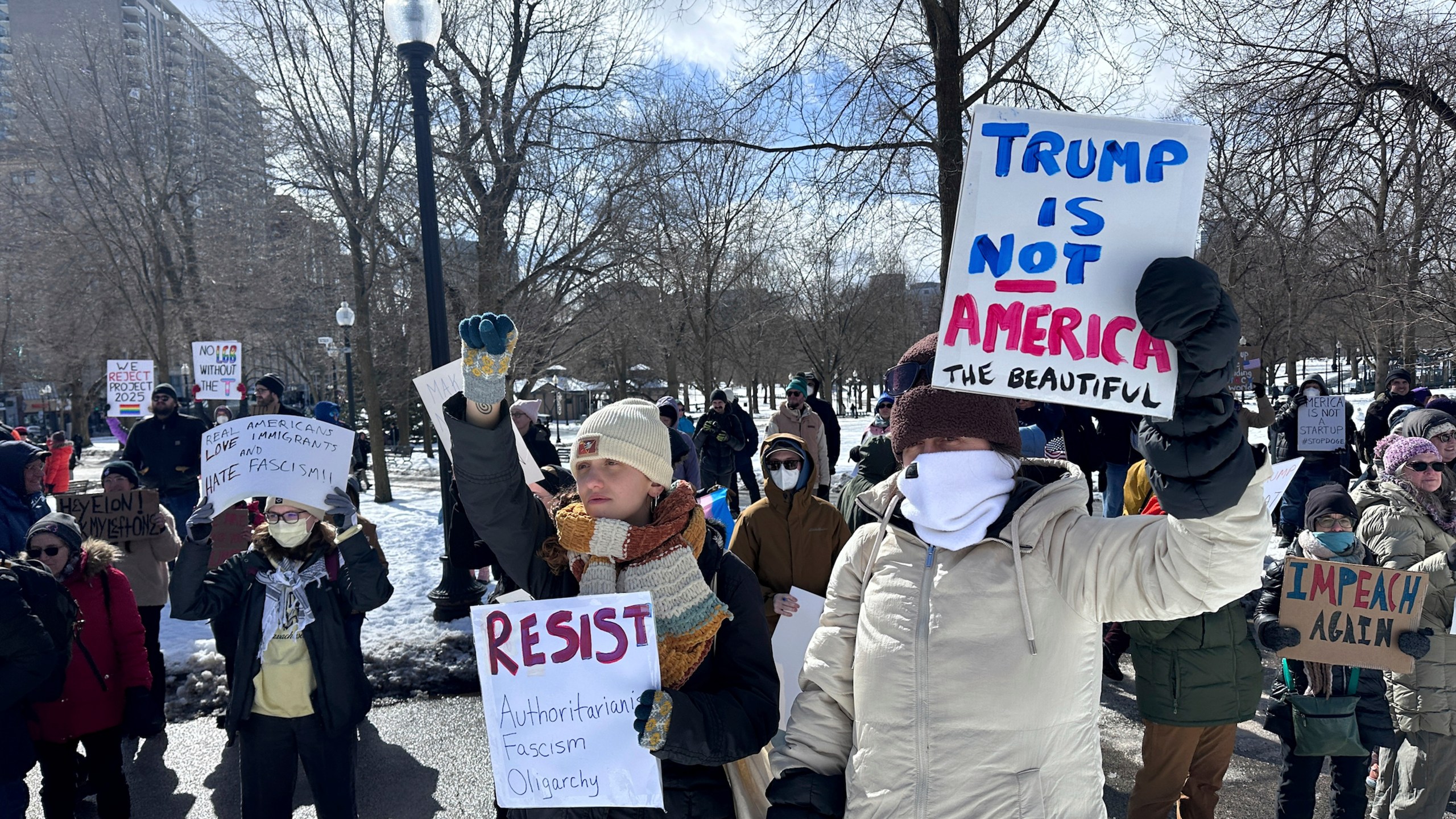 Demonstrators join more than a thousand people protesting the policies of the Trump administration marched from the Boston Common past City Hall to the North End, Monday, Feb. 17, 2025 in Boston. (AP/Michael Casey)