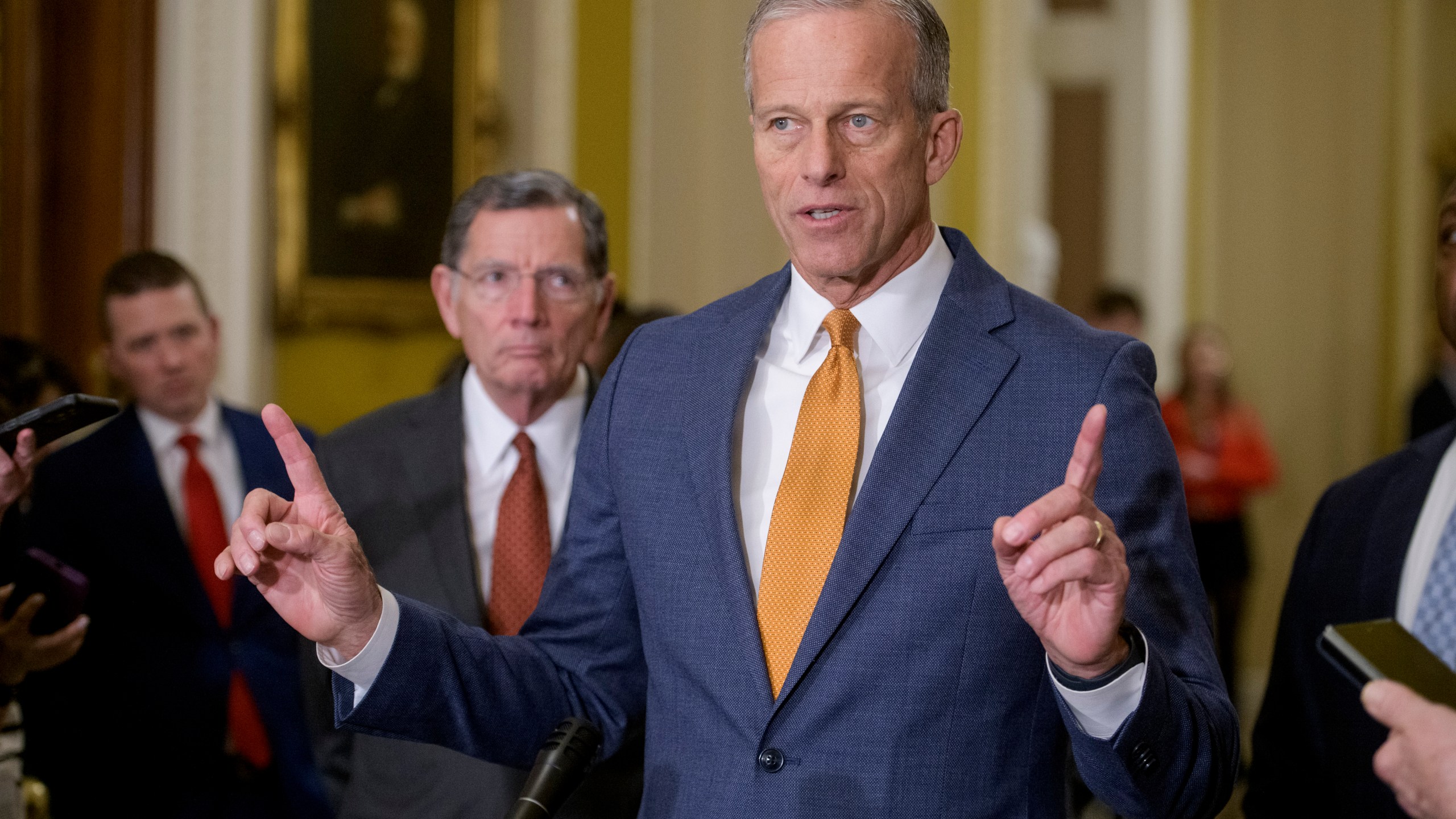 Sen. John Barrasso, R-Wyo., left, listens while Senate Majority Leader John Thune, R-S.D., speaks following the Senate Republican policy luncheon at the Capitol, Tuesday, Feb. 4, 2025, in Washington. (AP Photo/Rod Lamkey, Jr.)