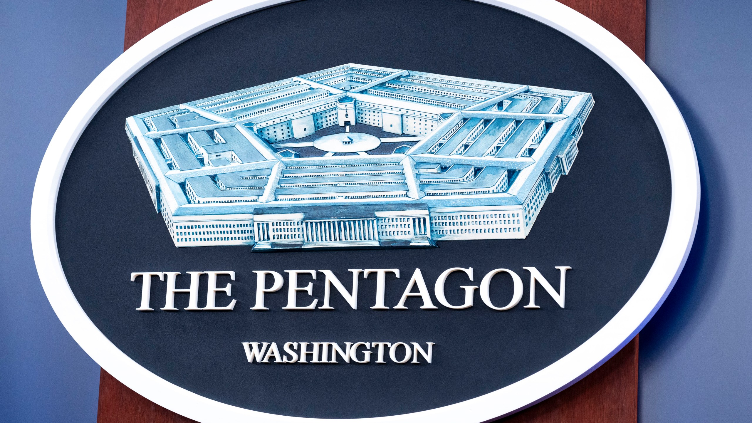 FILE - The Department of Defense logo is seen on the wall in the Press Briefing room at the Pentagon, Oct. 29, 2024, in Washington. (AP Photo/Kevin Wolf, File)
