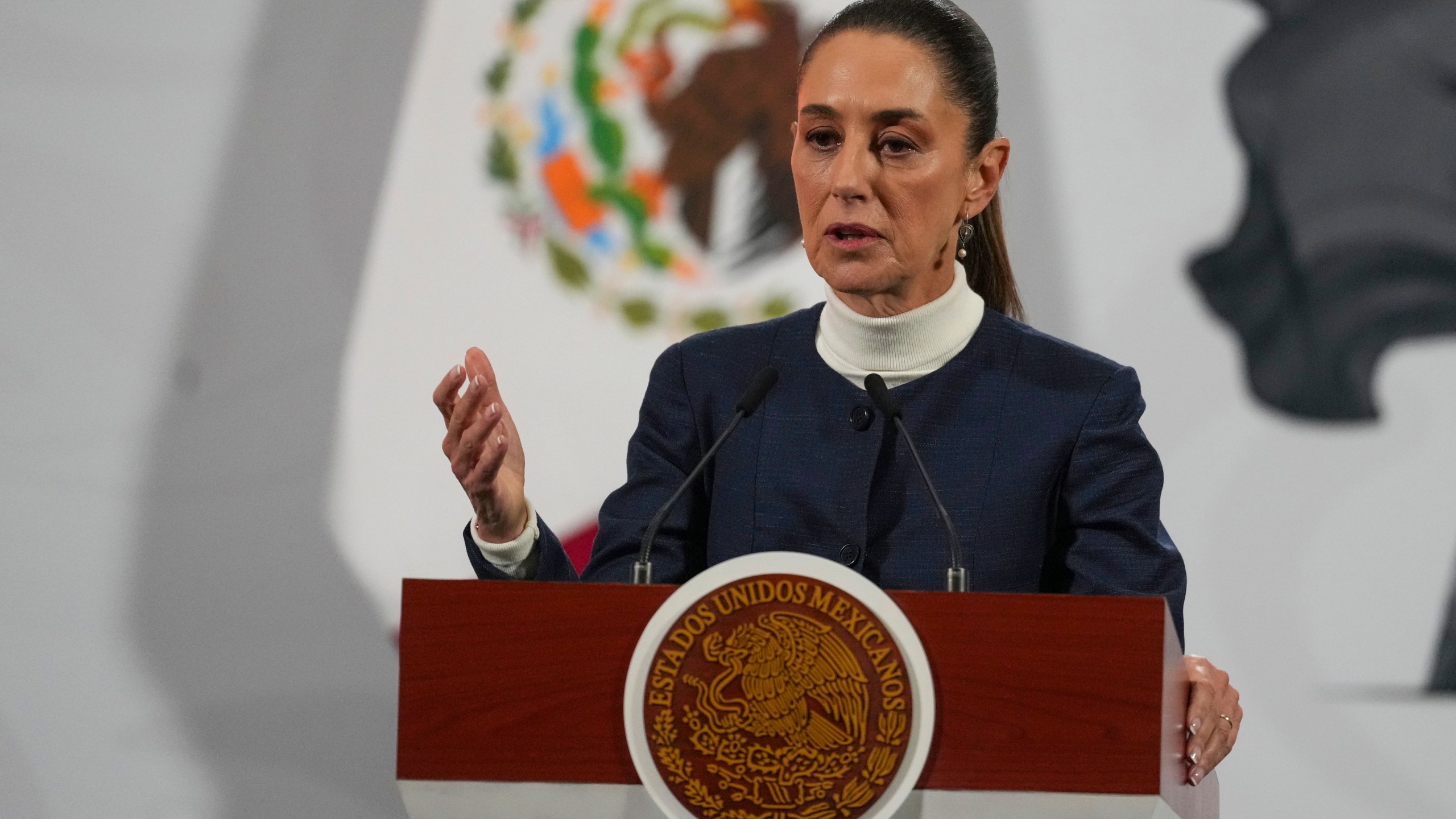 Mexican President Claudia Sheinbaum gives her daily morning press conference at the National Palace in Mexico City, Monday, Feb. 3, 2025. (AP Photo/Marco Ugarte)