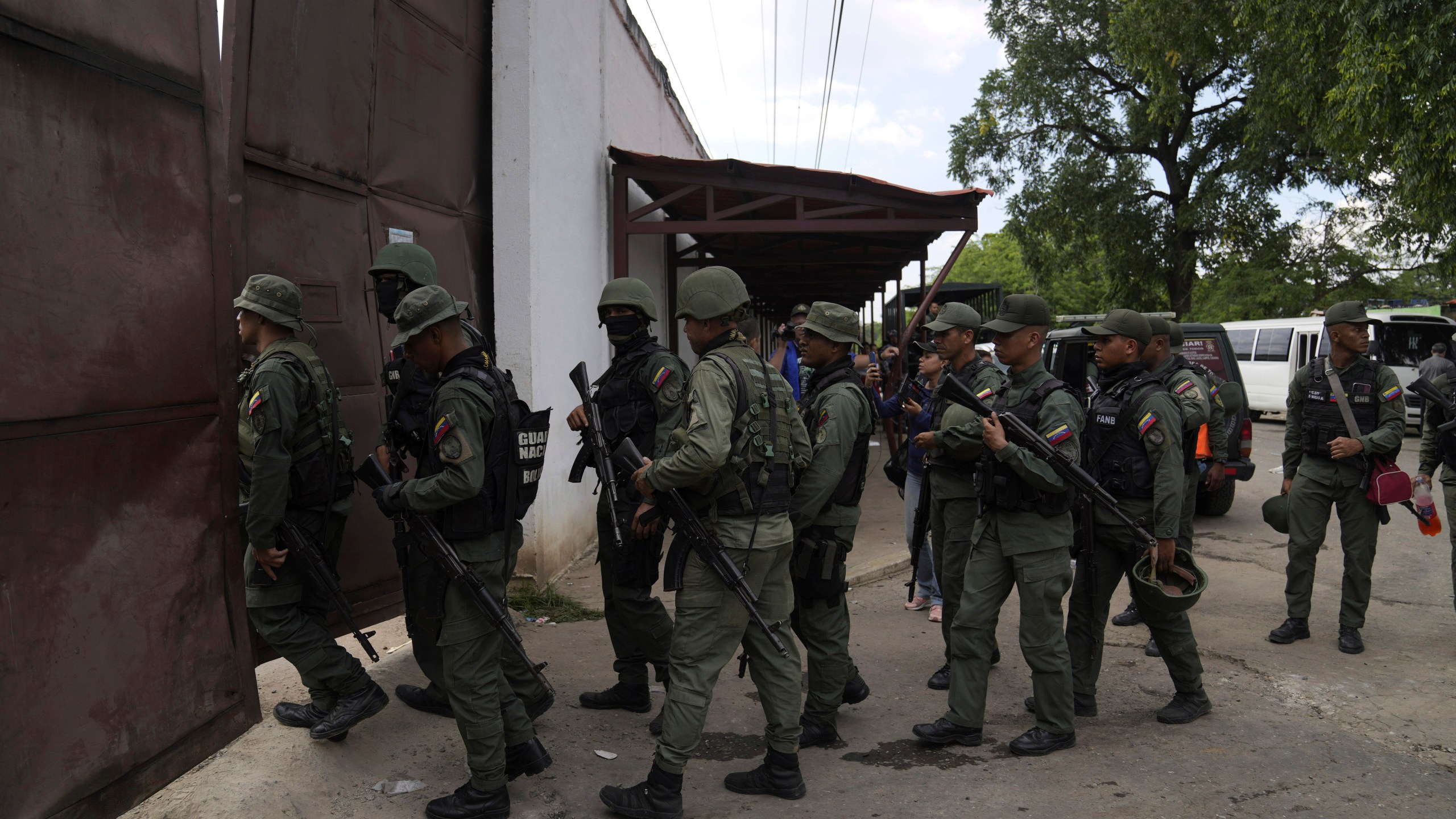 FILE - Soldiers raid the Tocorón Penitentiary Center, where the Tren de Aragua gang originated, in Tocorón, Venezuela, Sept. 20, 2023. (AP Photo/Ariana Cubillos, File)