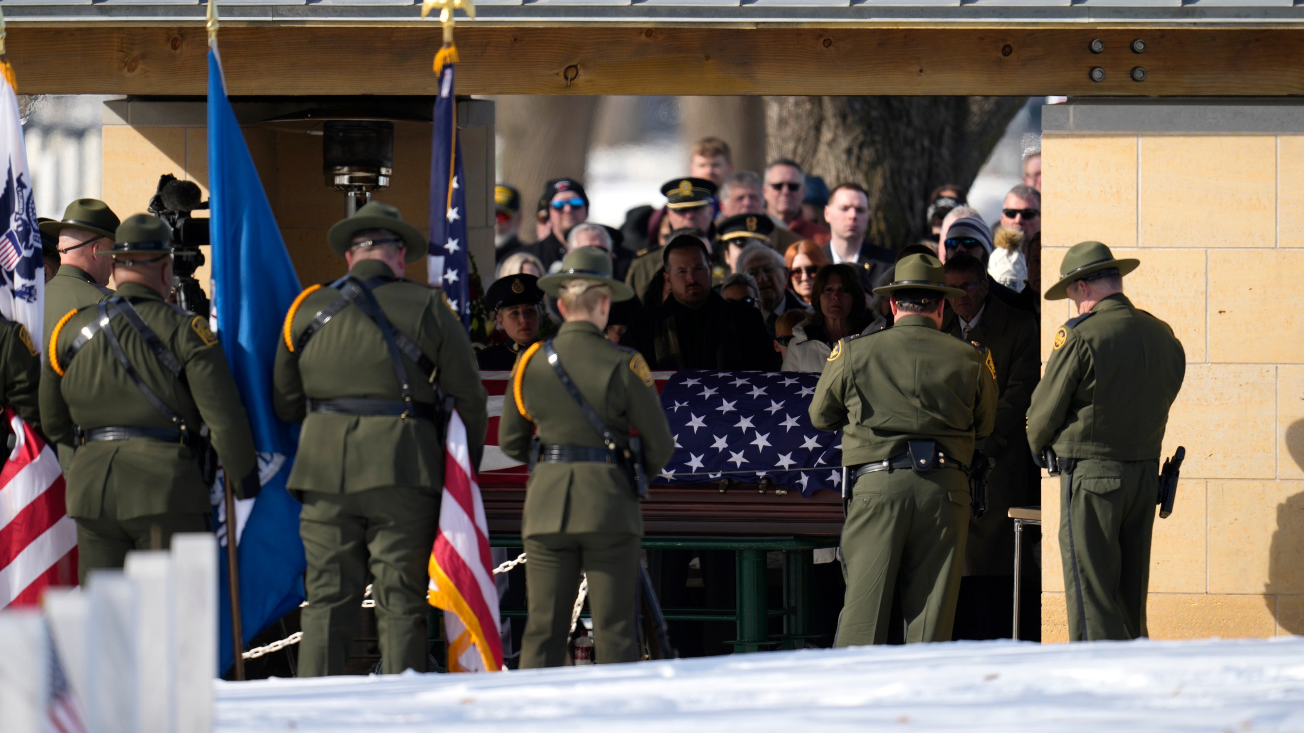 U.S. Border Patrol agent David Maland is recognized with military honors before his burial at Fort Snelling National Cemetery in Minneapolis, on Saturday, Feb. 22, 2025. (AP Photo/Abbie Parr)