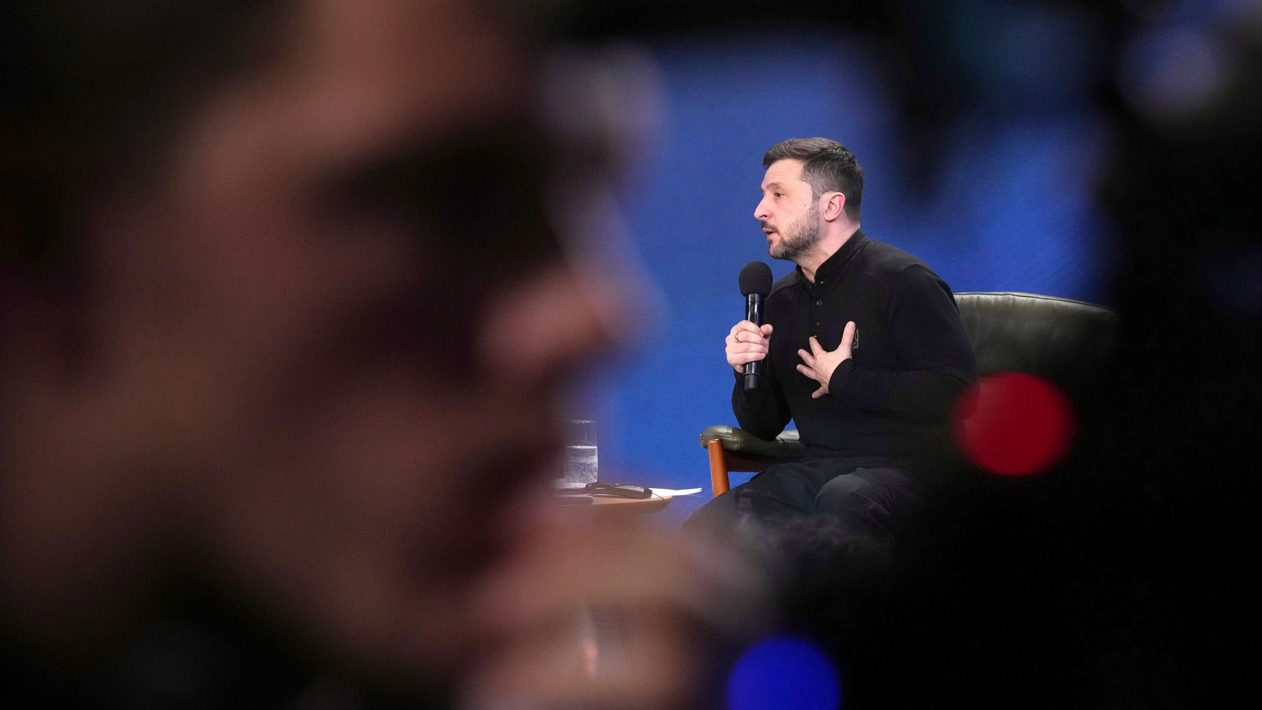 Ukrainian President Volodymyr Zelenskyy answers media questions during his press conference, in Kyiv, Ukraine, Sunday, Feb. 23, 2025. (AP Photo/Evgeniy Maloletka)